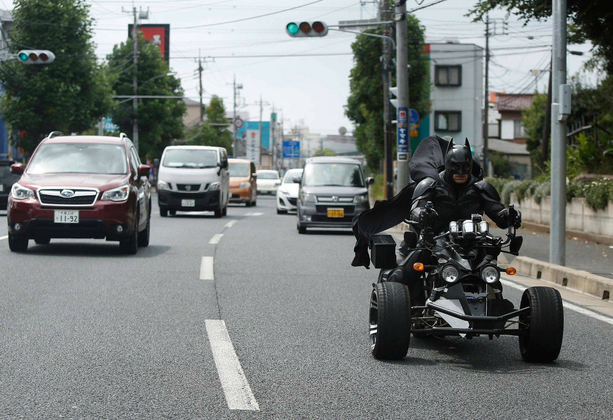 A 41-year-old man going by the name of Chibatman rides his "Chibatpod" on the road in Chiba, east of Tokyo