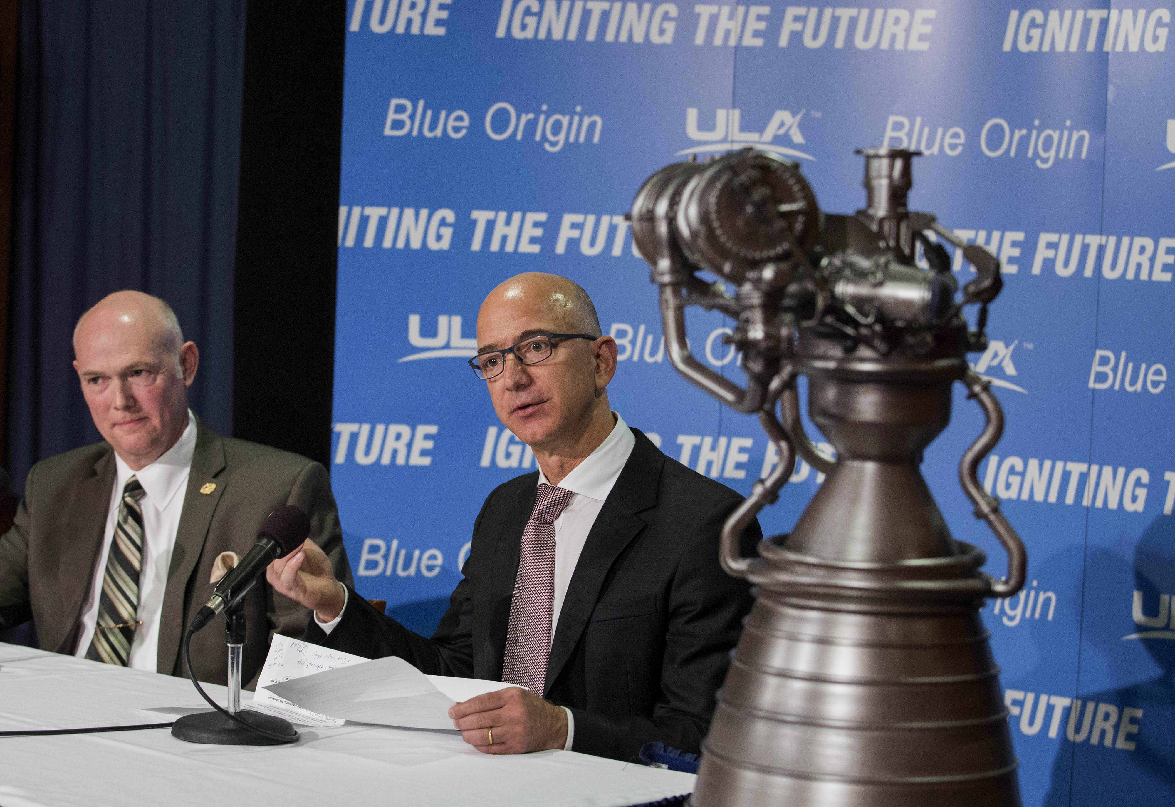 Lost is space? Bezos (right) and ULA chief Tory Bruno show off the goods on Sept. 17, 2014 in Washington.