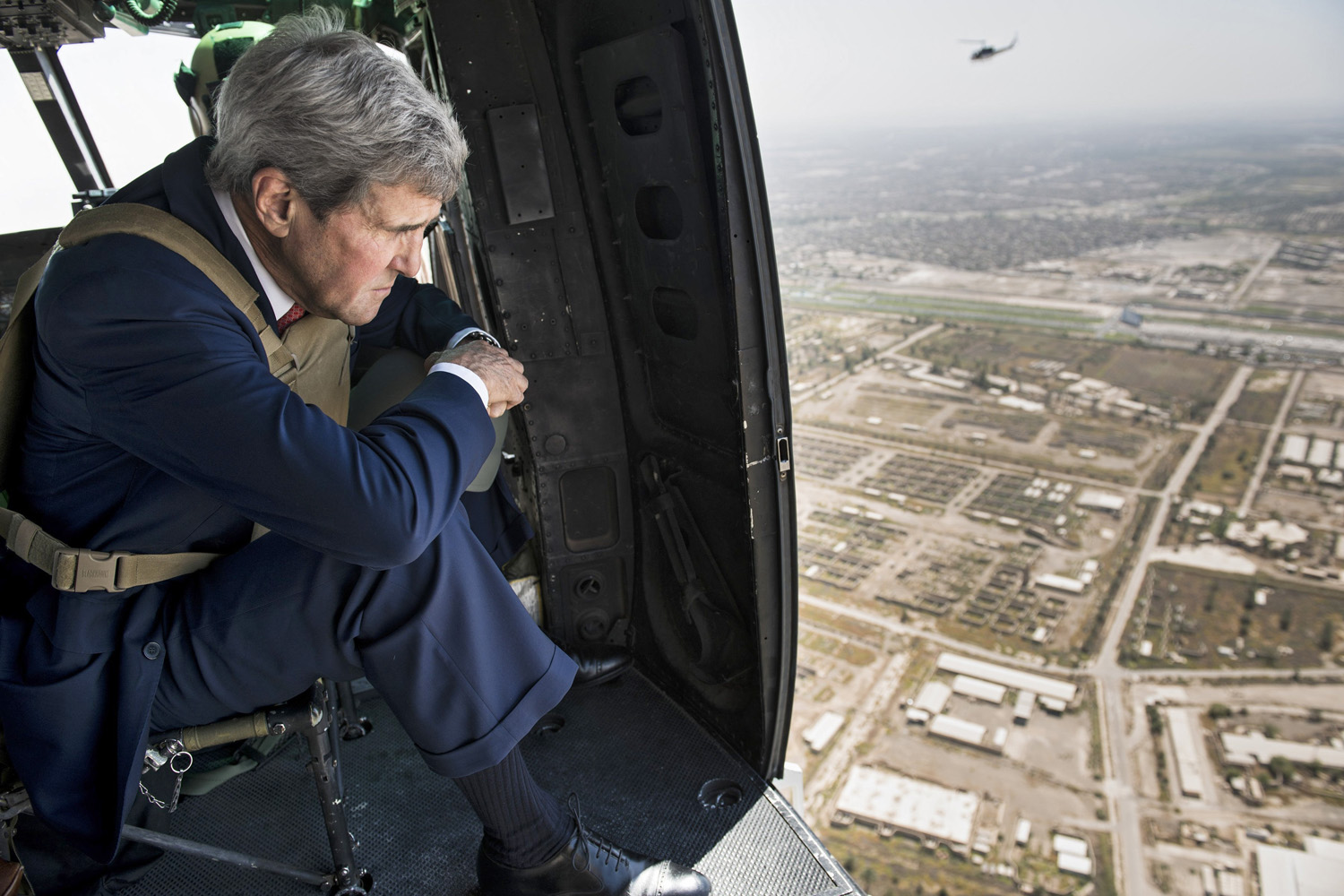 Secretary of State John Kerry looks out from a helicopter over Baghdad on Wednesday.