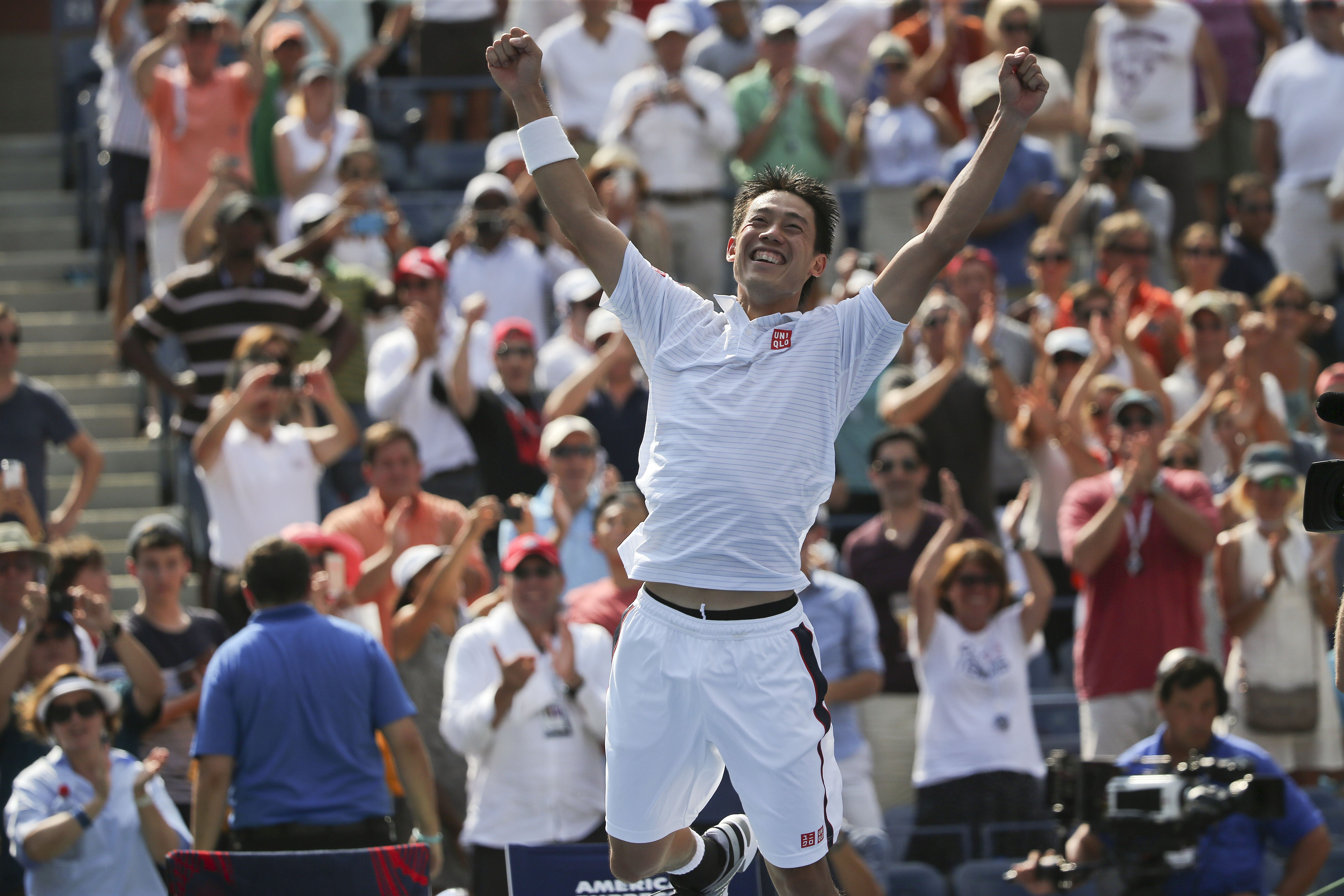Kei Nishikori, of Japan, reacts after defeating Novak Djokovic, of Serbia, during the semifinals of the 2014 U.S. Open tennis tournament in New York City on Sept. 6, 2014.