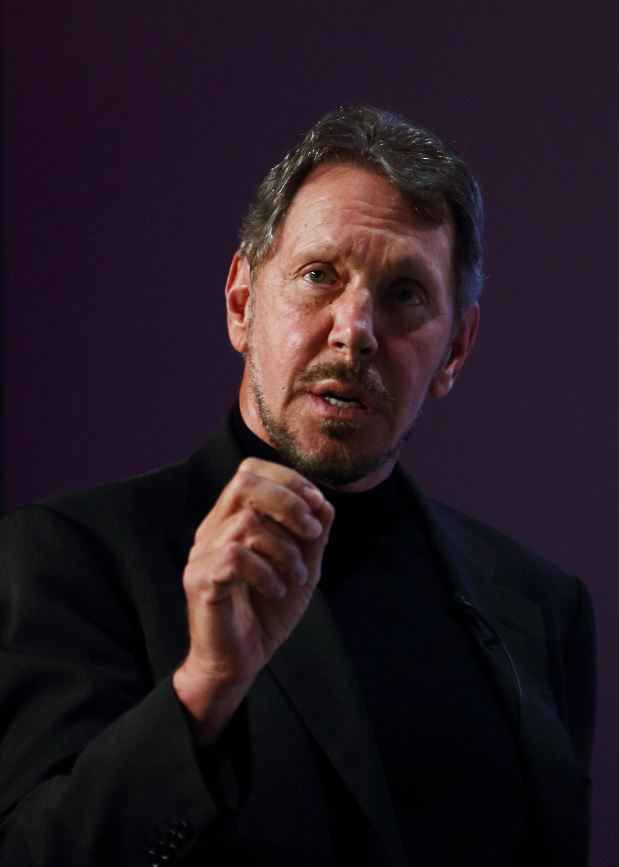Larry Ellison, chief executive officer of Oracle Corp., makes a speech at the New Economy Summit 2014 in Tokyo on April 9, 2014. 