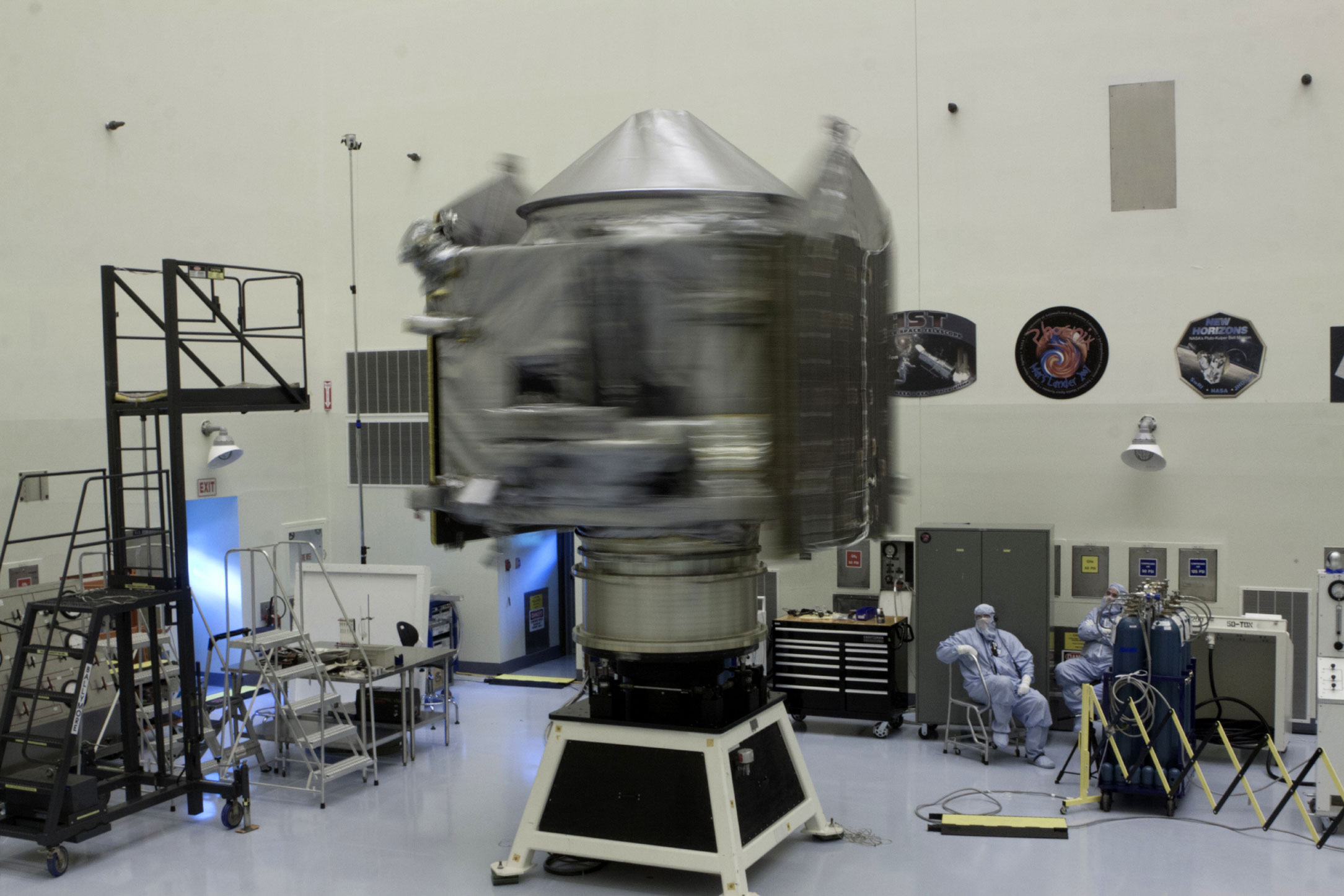 Inside the Payload Hazardous Servicing Facility at NASA's Kennedy Space Center in Florida, engineers and technicians perform a spin test of the Mars Atmosphere and Volatile Evolution, or MAVEN, spacecraft. The operation is designed to verify that MAVEN is properly balanced as it spins during the initial mission activities.
