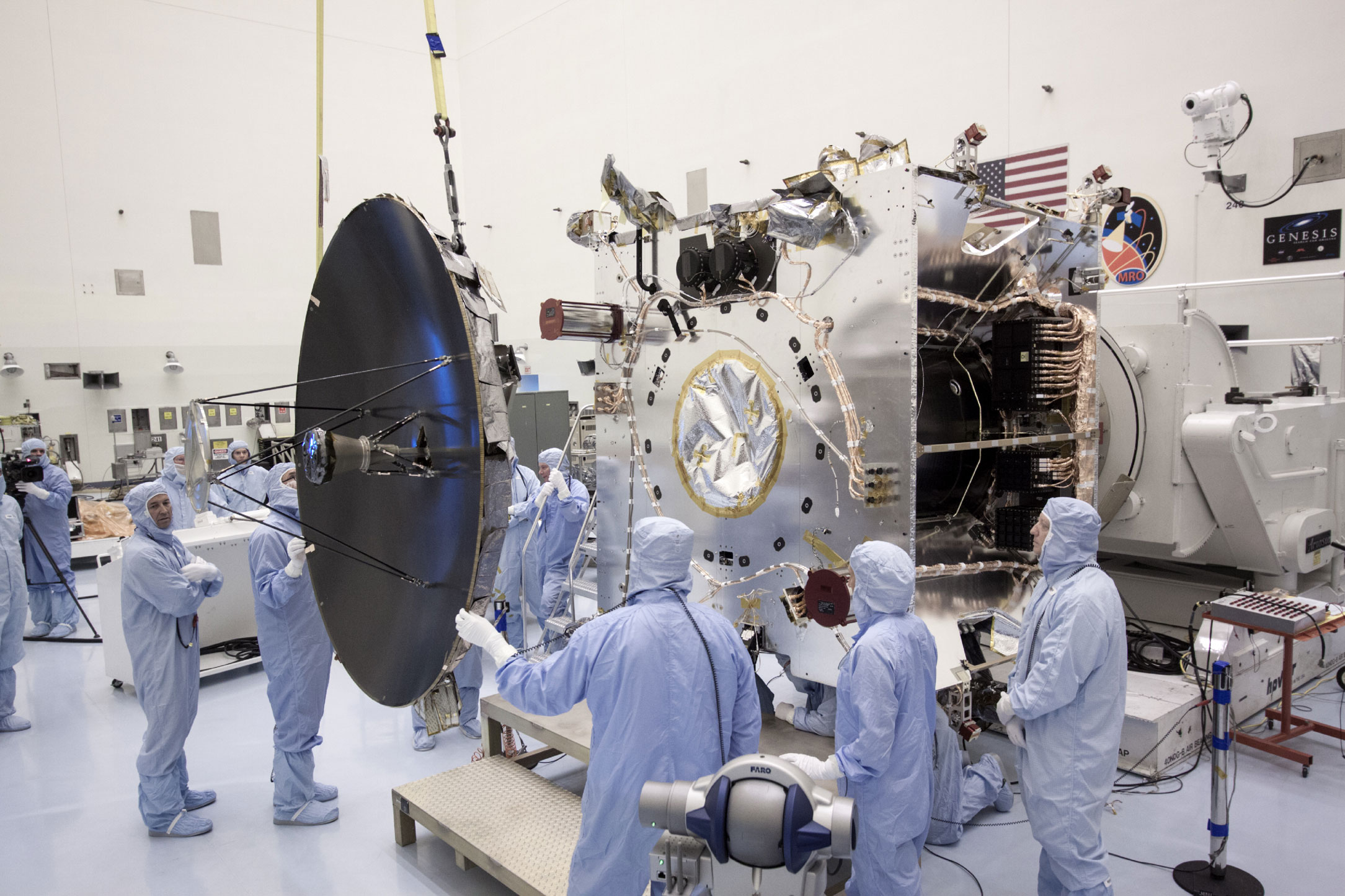 Technicians install the parabolic high gain antenna onto the MAVEN spacecraft in the Payload Hazardous Servicing Facility on Aug. 9, 2013. The antenna will communicate vast amounts of data to Earth during the mission.