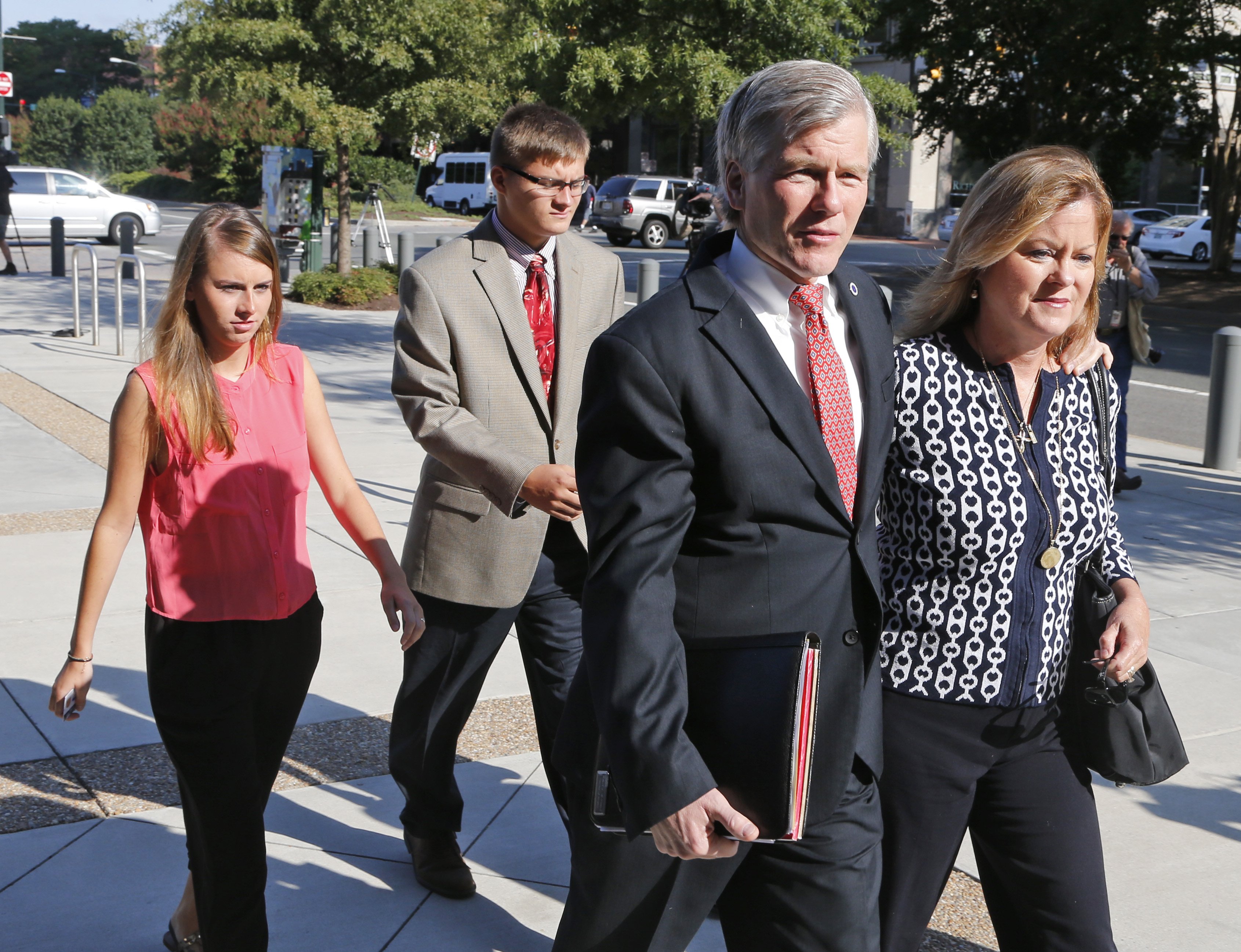 Former Virginia Gov. Bob McDonnell, second left, talks to his sister Eileen Reinamanas they arrive at federal court for the third day of jury deliberations in his corruption trial in Richmond, Va., Thursday, Sept. 4, 2014. (Steve Helber&amp;amp;—AP)