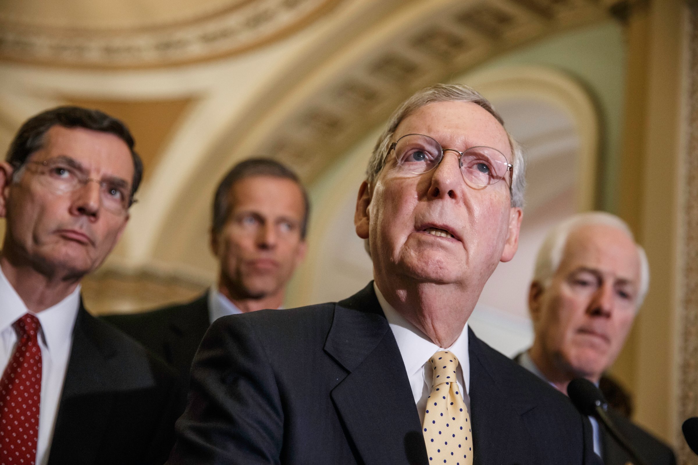 Senate Minority Leader Mitch McConnell, R-Ky., and GOP lawmakers, from left, Sen. John Barrasso, R-Wyo., Sen. John Thune, R-S.D., and Senate Minority Whip John Cornyn, R-Texas, face reporters after a Republican caucus meeting, at the Capitol in Washington on June 10, 2014.