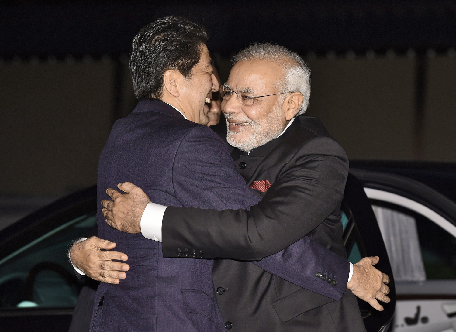 Japan’s Prime Minister Shinzo Abe hugs Modi upon 
                      his arrival at the state guesthouse in the Japanese city of Kyoto (TORU YAMANAKA—AFP/Getty Images)