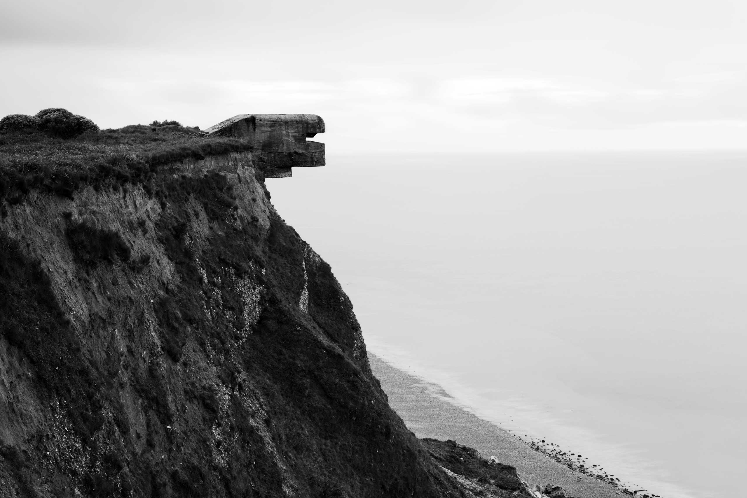 A concrete bunker used by the German Army in World War II sits atop a hill along the route of the Atlantic Wall (Atlantikwall in German).