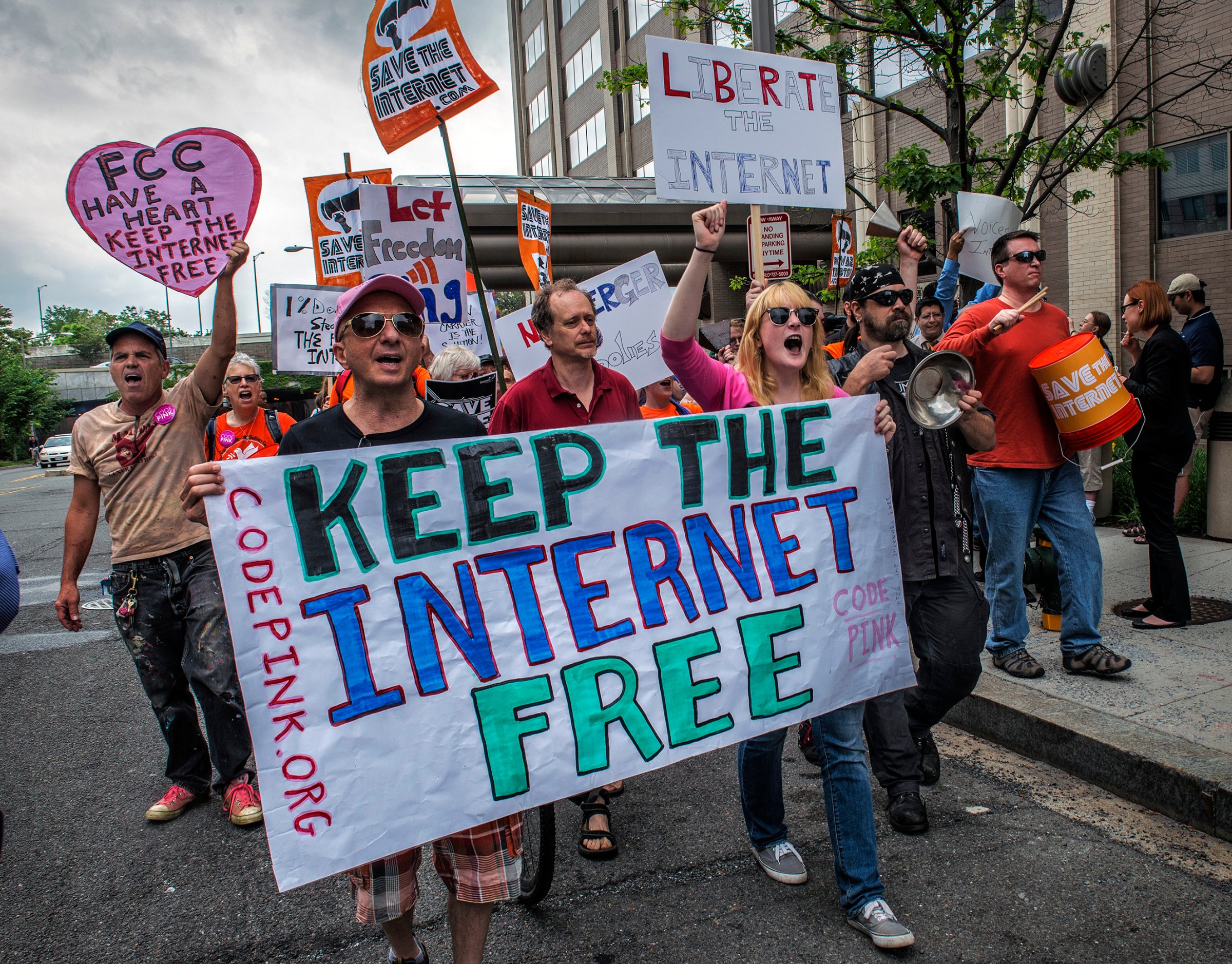Protesters hold a rally before the FCC meeting on net neutrality proposal in Washington, DC.