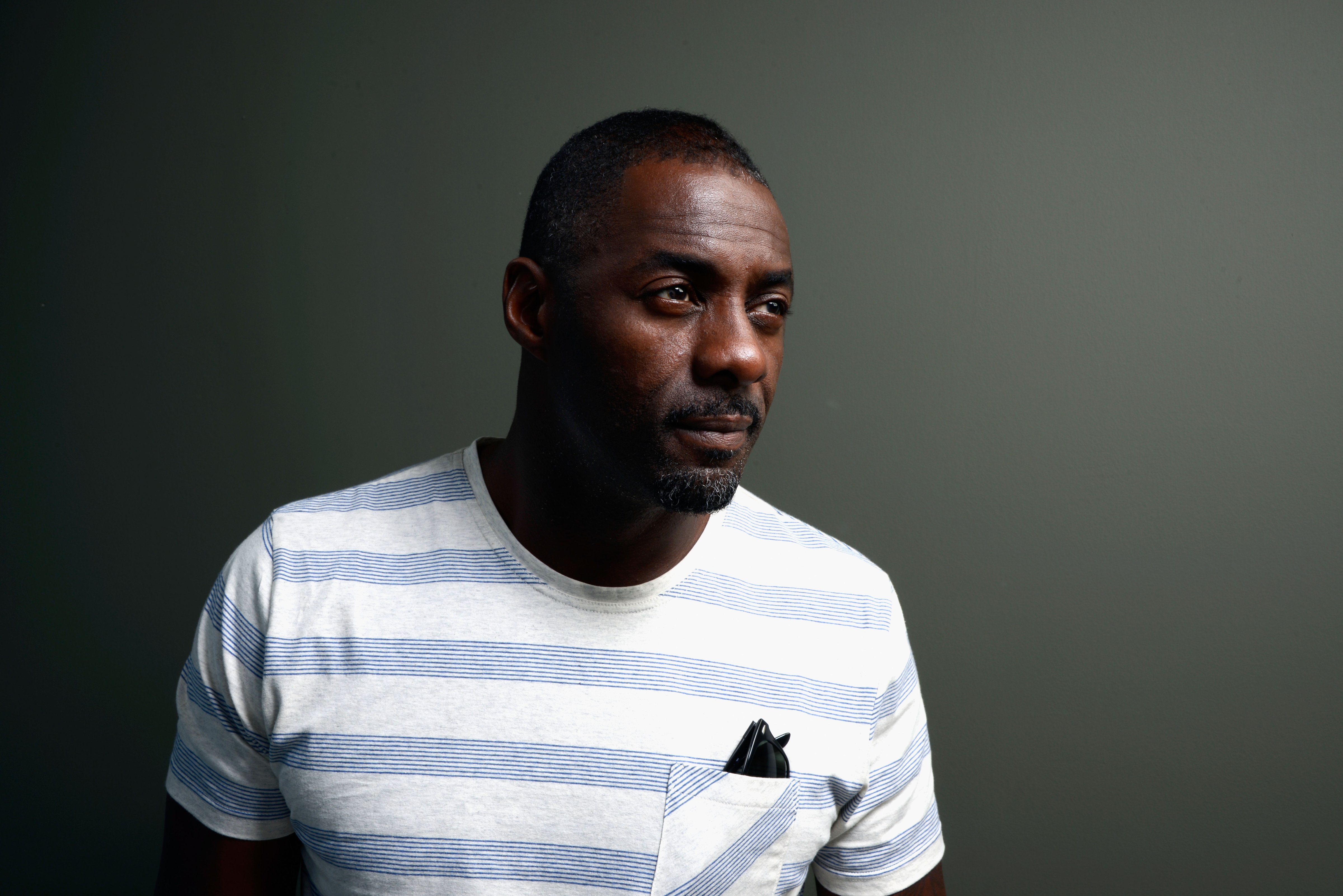 Actor Idris Elba of poses at the Guess Portrait Studio during the 2013 Toronto International Film Festival on September 8, 2013 in Toronto. (Larry Busacca—Getty Images)