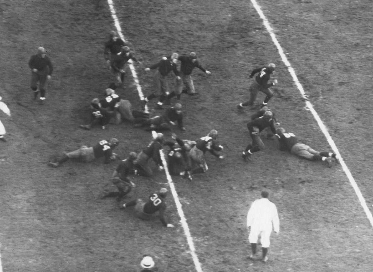 The Notre Dame Fighting Irish run on the field during a game circa 1931 at the Notre Dame Stadium in South Bend, Ind. (Collegiate Images / Getty Images)
