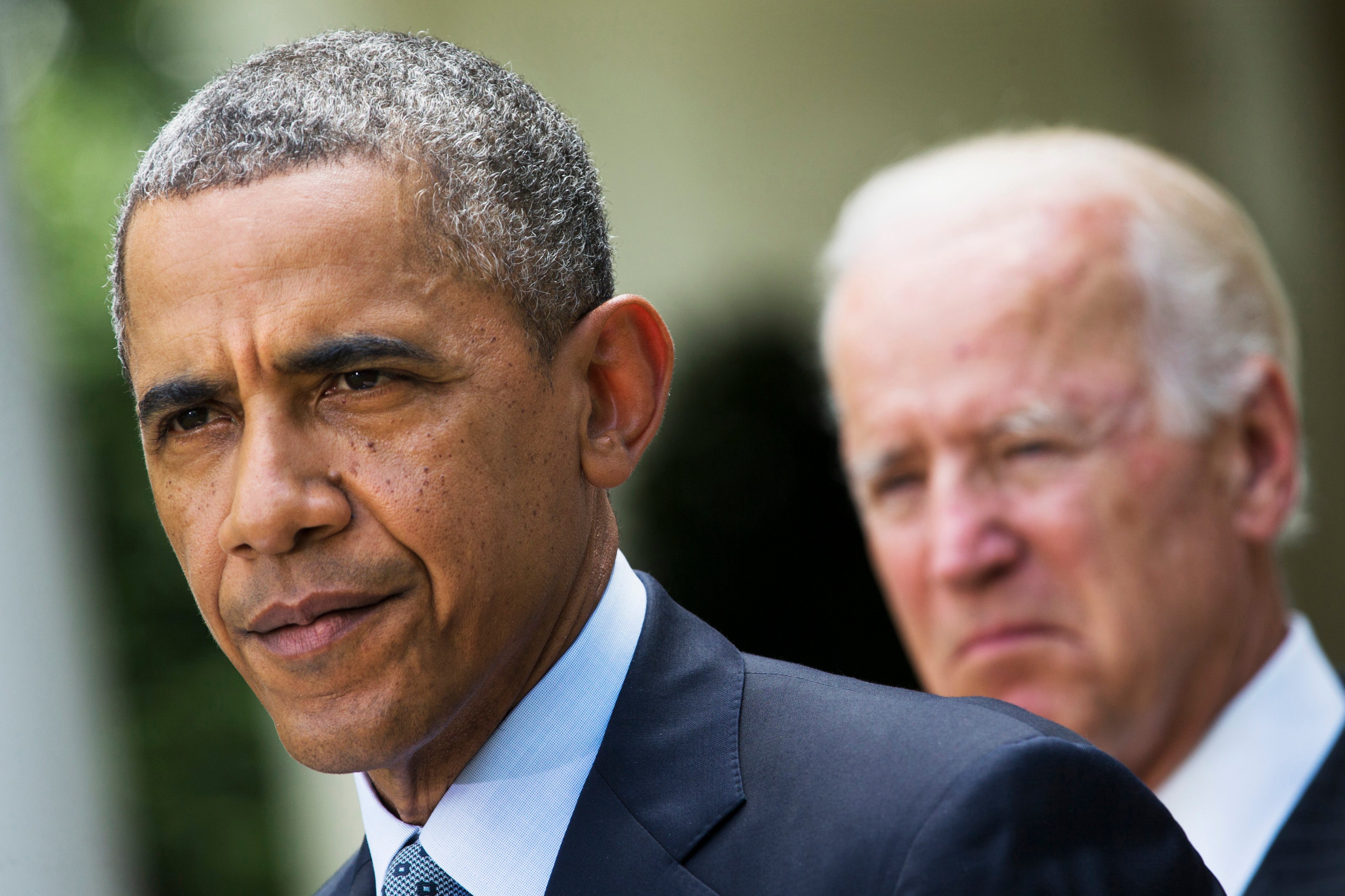 President Barack Obama, accompanied by Vice President Joe Biden, pauses while making a statement about immigration reform, in the Rose Garden of the White House in Washington on June 13, 2014. (Jacquelyn Martin—AP)
