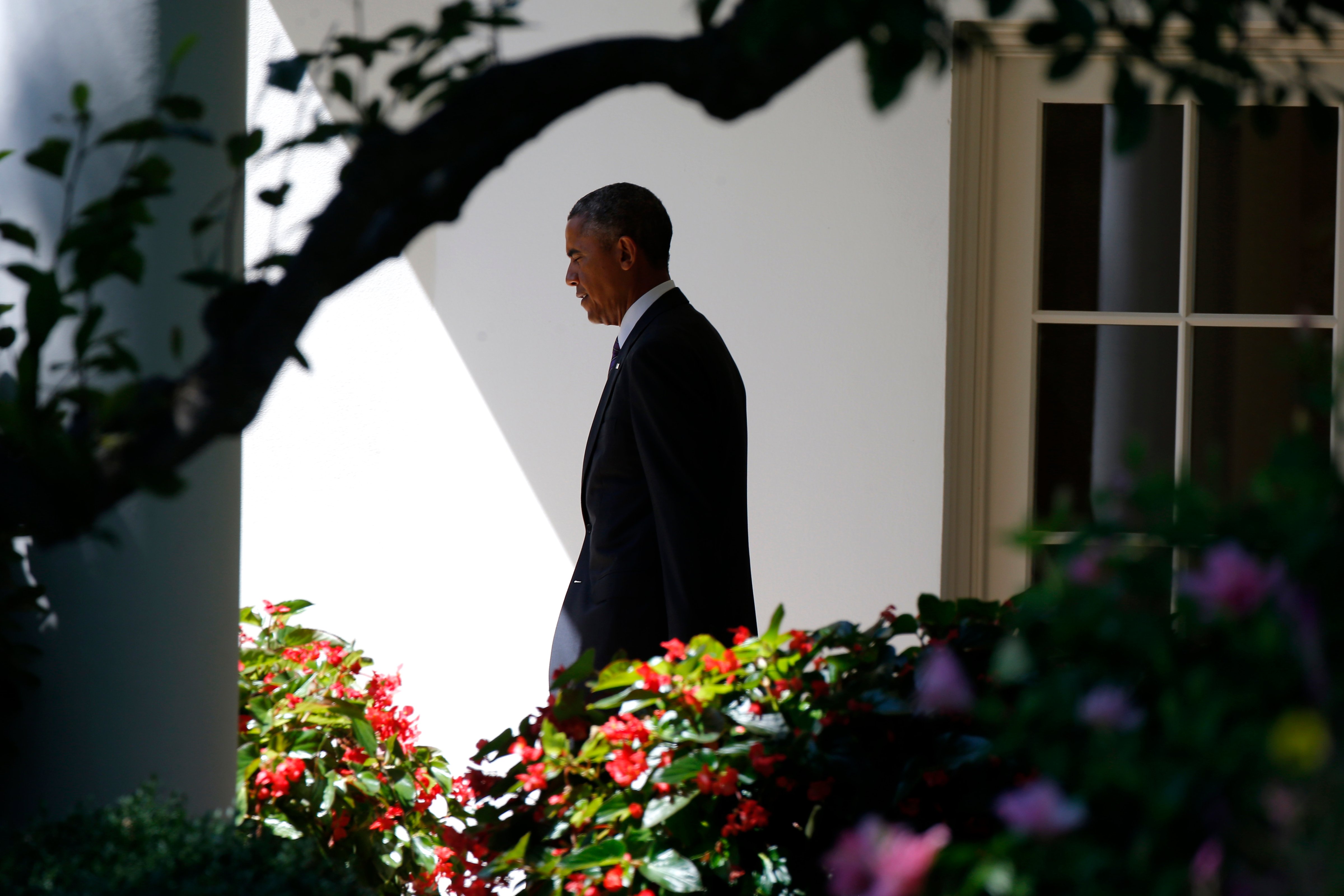 President Barack Obama walks out of the Oval Office towards the South Lawn of the White House in Washington, on Aug. 29, 2014. (Charles Dharapak—AP)