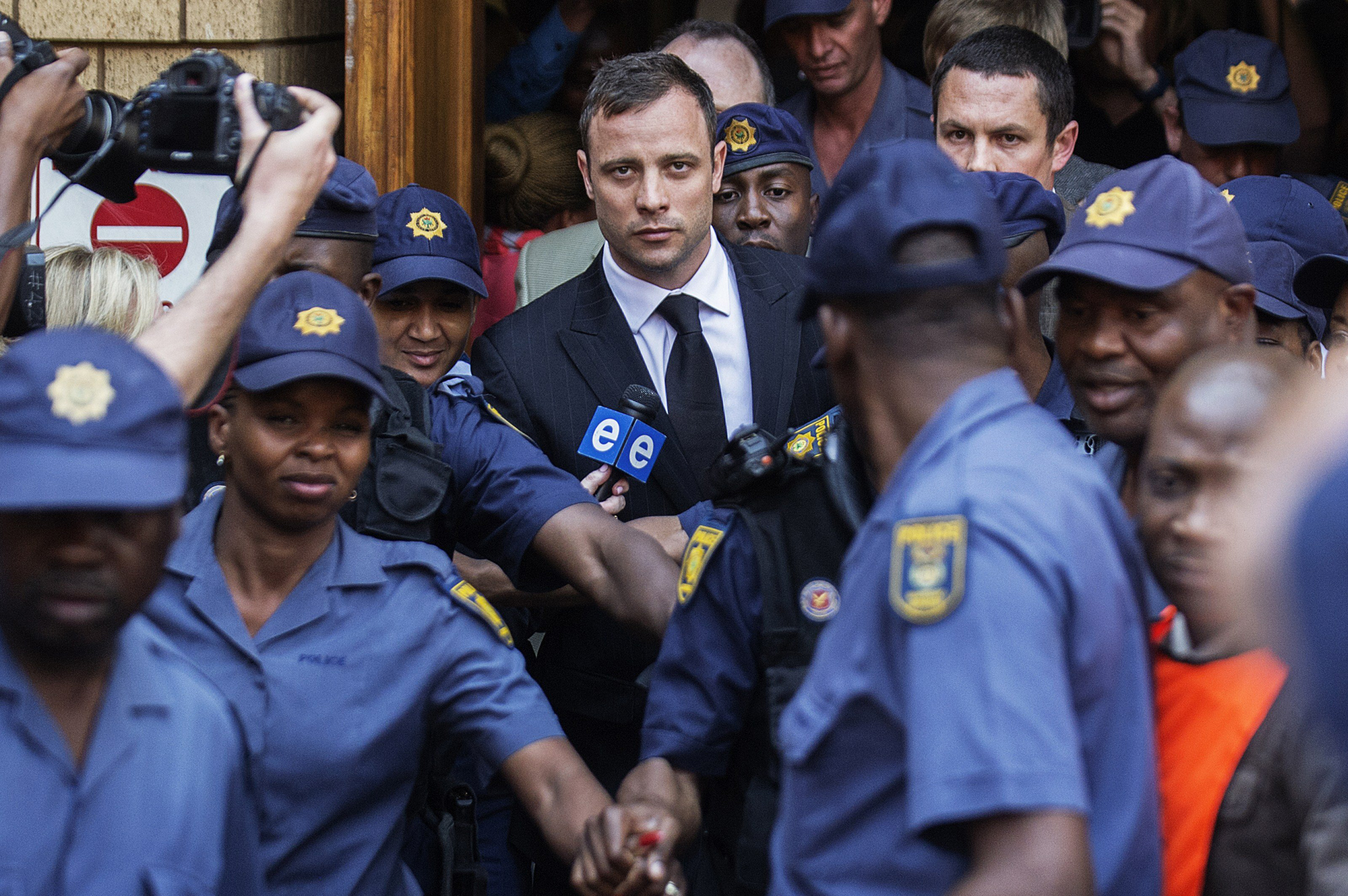 South African Paralympian athlete Oscar Pistorius leaves the High Court after the verdict in his murder trial where he was found guilty of culpable homicide in Pretoria, South Africa on Sept. 12, 2014. (Gianluigi Guercia—AFP/Getty Images)
