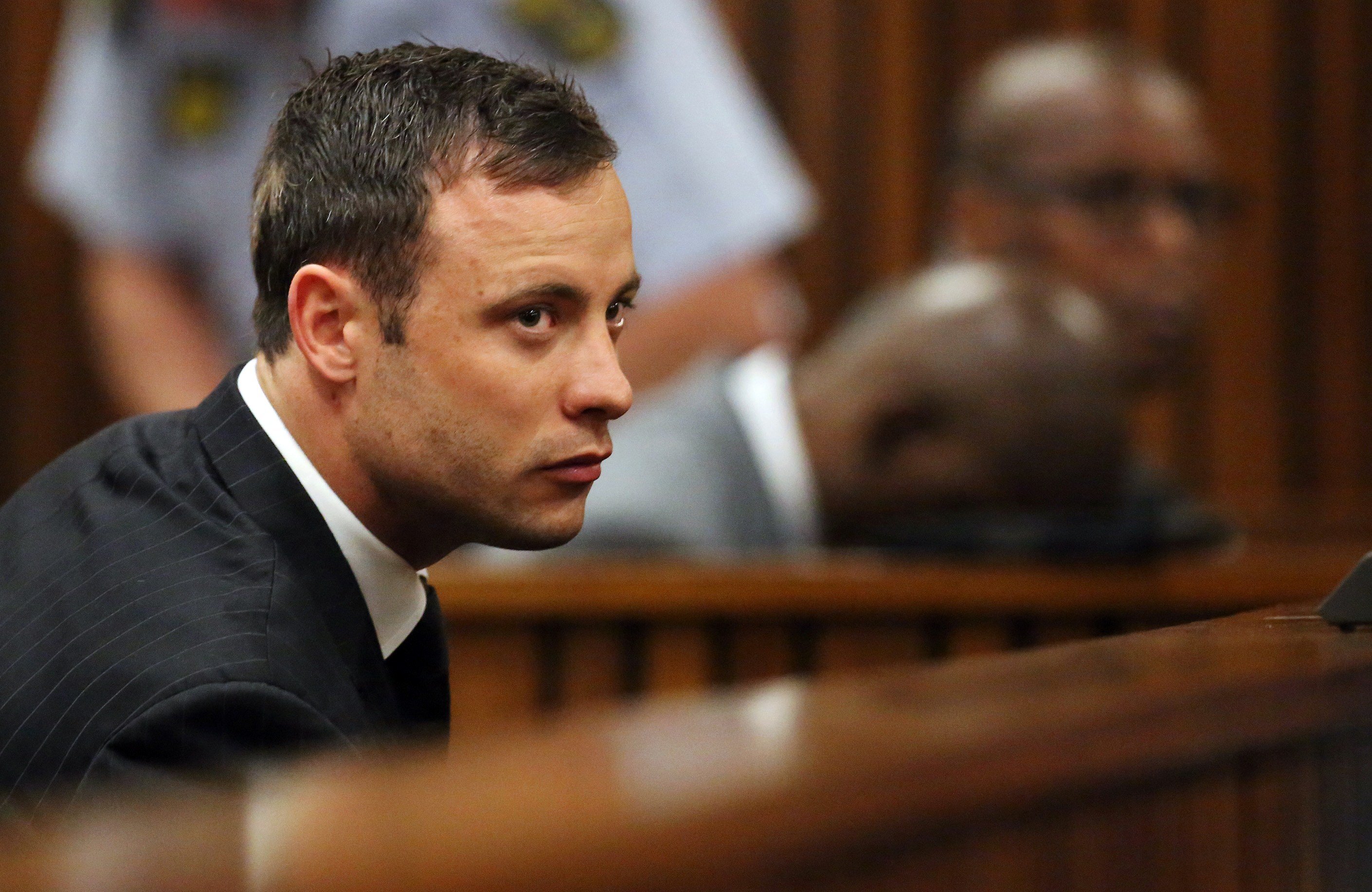 Oscar Pistorius listens to the verdict in his murder trial in the High Court in Pretoria on September 12, 2014. (Siphiwe Sibeko—AFP/Getty Images)