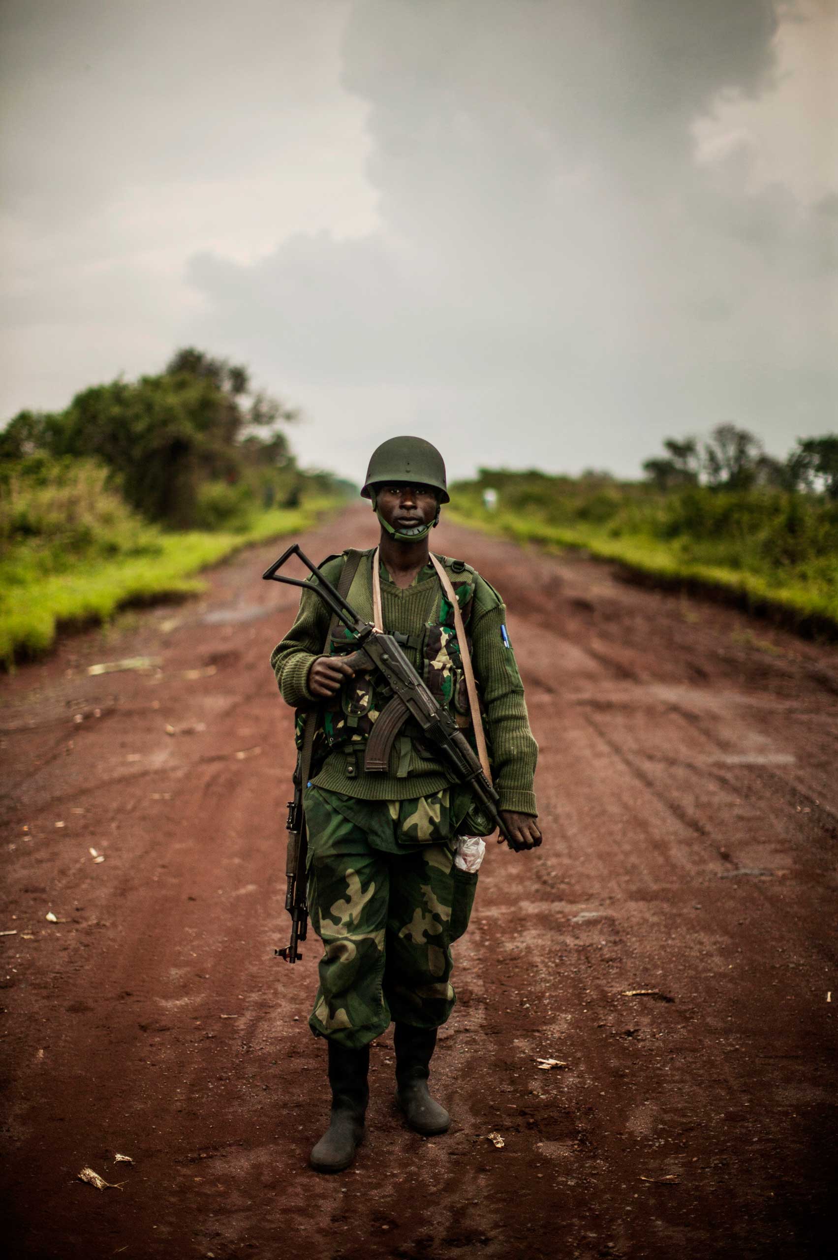 A Congolese soldier stands at the farthest advance point in Kibumba, outside Goma.