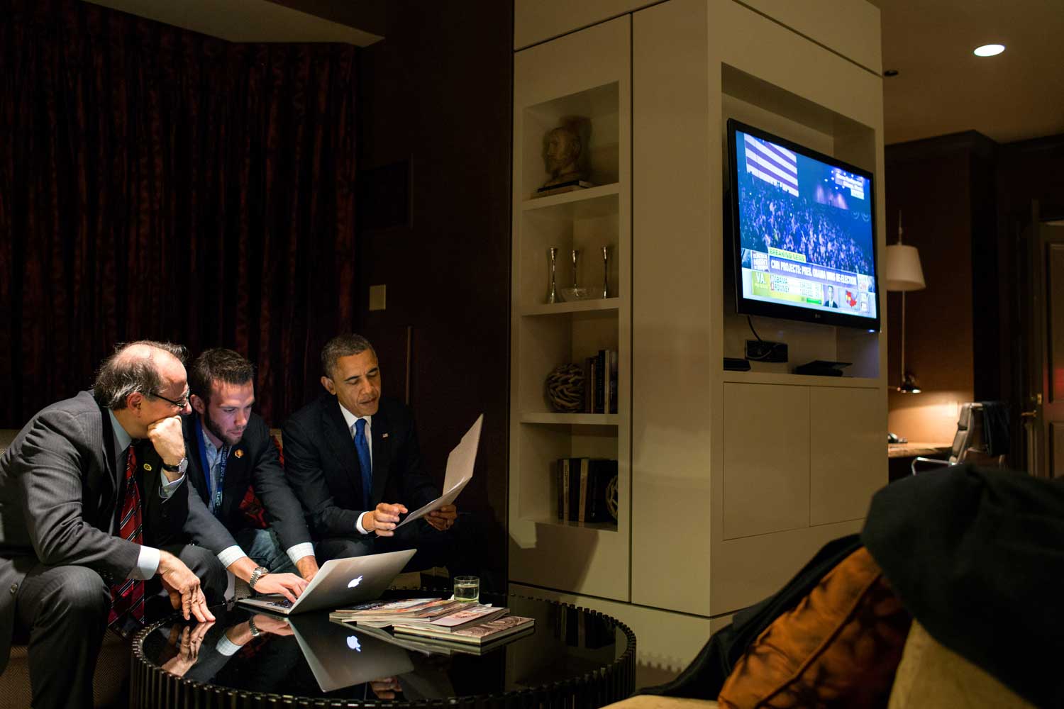 President Barack Obama reviews his election speech with Jon Favreau, Director of Speechwriting, and David Axelrod in the Presidential Suite at the Fairmont Chicago Millennium Park in Chicago, Ill., Nov. 6, 2012.