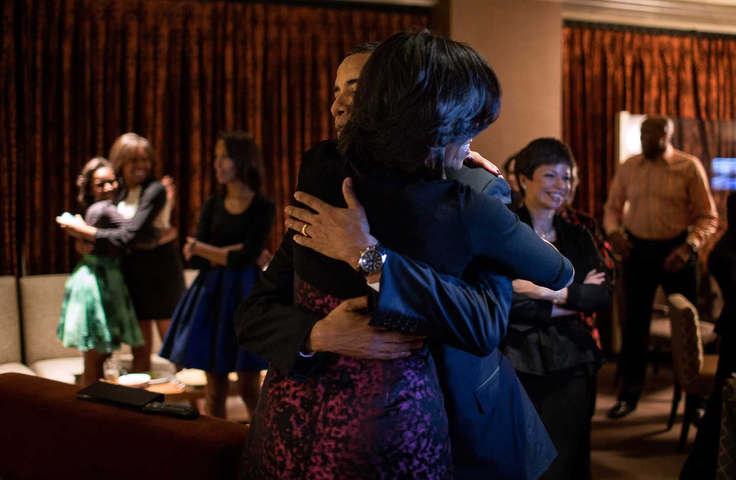 President Barack Obama and First Lady Michelle Obama embrace after watching CNN project the outcome of the election, at the Fairmont Chicago Millennium Park in Chicago, Ill., Nov. 6, 2012.