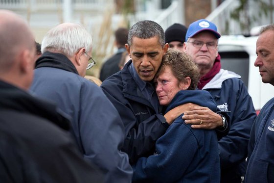 President Barack Obama talks with Donna Vanzant, owner of the North Point Marina in Brigantine, New Jersey, Oct. 31, 2012. The President was surveying damage caused by Hurricane Sandy.