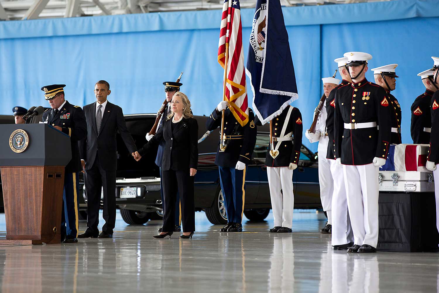 President Barack Obama, Vice President Joe Biden and Secretary of State Hillary Rodham Clinton attend the dignified transfer at Joint Base Andrews, Maryland, Sept. 14, 2012, of J. Christopher Stevens, U.S. Ambassador to Libya; Sean Smith, Information Management Officer; and Security Personnel Glen Doherty and Tyrone Woods, who were killed in the attack on the U.S. Consulate in Benghazi, Libya.
