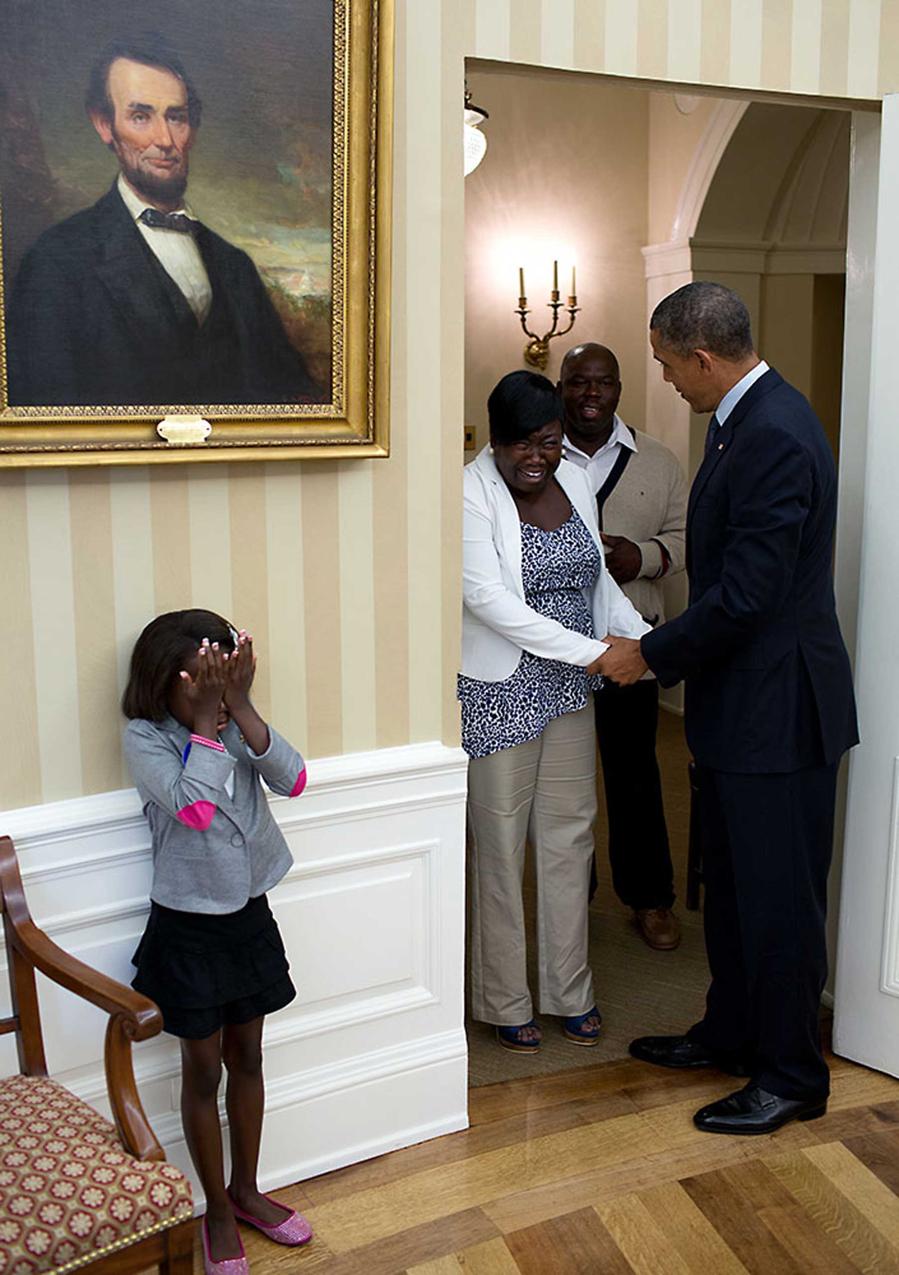 Eight-year old Make-A-Wish child Janiya Penny reacts after meeting President Barack Obama as he welcomes her family to the Oval Office, Aug. 8, 2012.