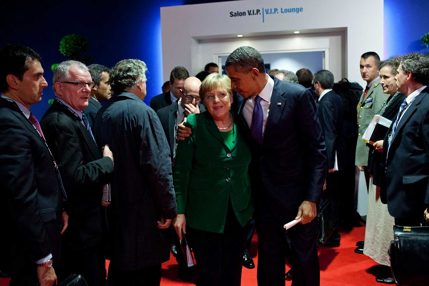 "After a meeting with Eurozone leaders adjacent to the G20 Summit in Cannes, France, the President gave encouragement to German Chancellor Angela Merkel as they departed the meeting, Nov. 3, 2011."