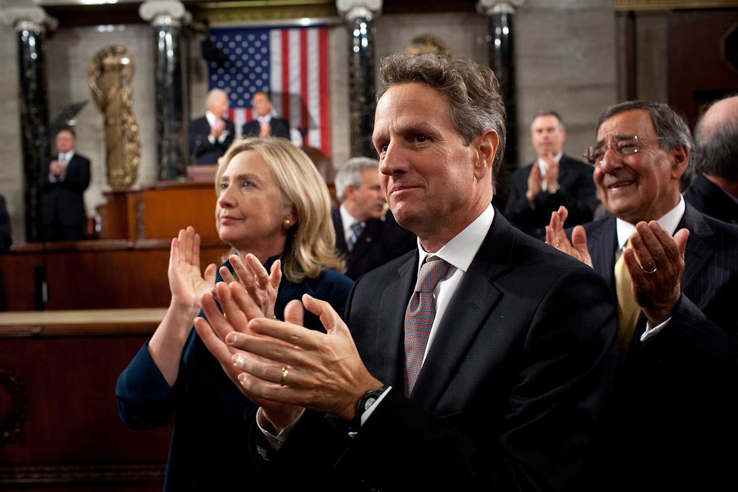 Cabinet Secretaries Hillary Clinton, Tim Geithner and Leon Panetta applaud as President Obama is escorted into the House Chamber of the United States Capitol, prior to addressing a Joint Session of Congress on jobs and the economy, and to outline the details of the American Jobs Act, at the U.S. Capitol, Washington, D.C., Sept. 8, 2011.