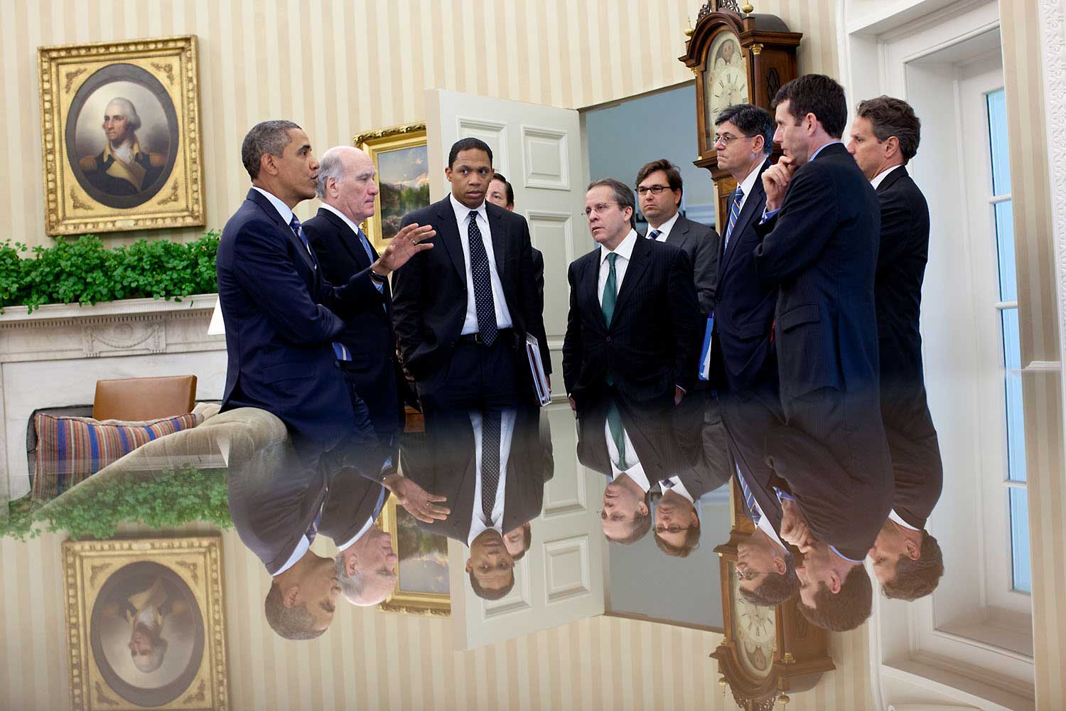 "The reflection in this photo (since so many people ask me) was taken with my camera just above a small glass-topped table in the Oval Office as the President talked with members of his staff following a meeting with the Congressional leadership, July 7, 2011."