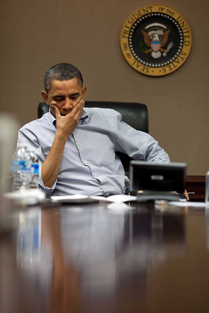 President Obama meets with his national security staff during a conference call on Libya in the Situation Room of the White House, Saturday, March 26, 2011.