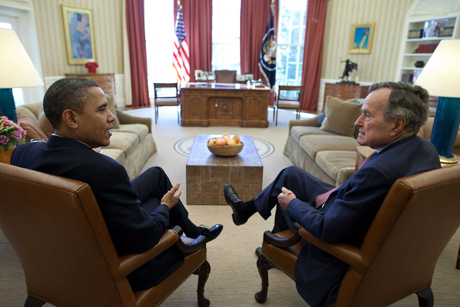 President Obama meets with former President George H. W. Bush in the Oval Office, Feb. 15, 2011.