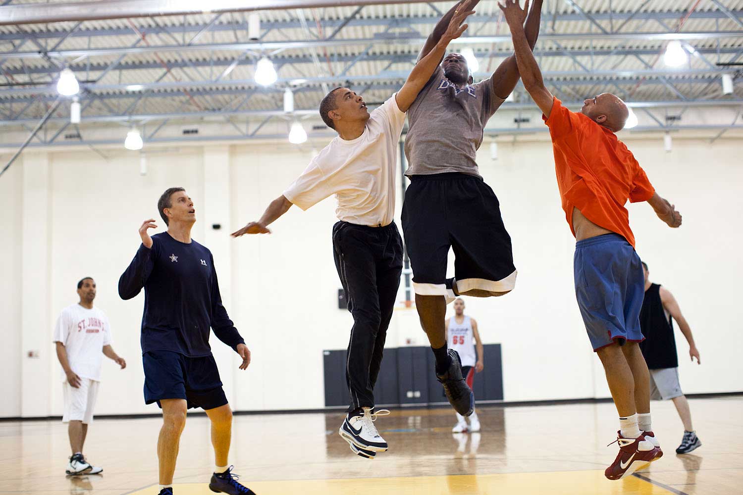 President Obama tries to block a layup shot by his former personal aide, Reggie Love, at Fort McNair in Washington, D.C., May 16, 2010.