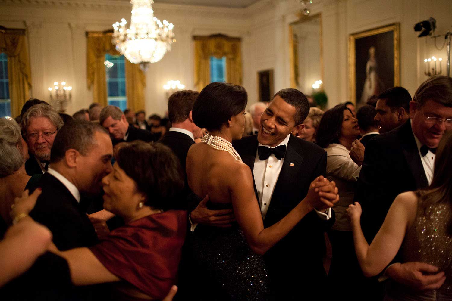The President dances with his wife while singing along with the band Earth, Wind & Fire during the Governors Ball, his first formal function at the White House, on Feb. 22, 2009
