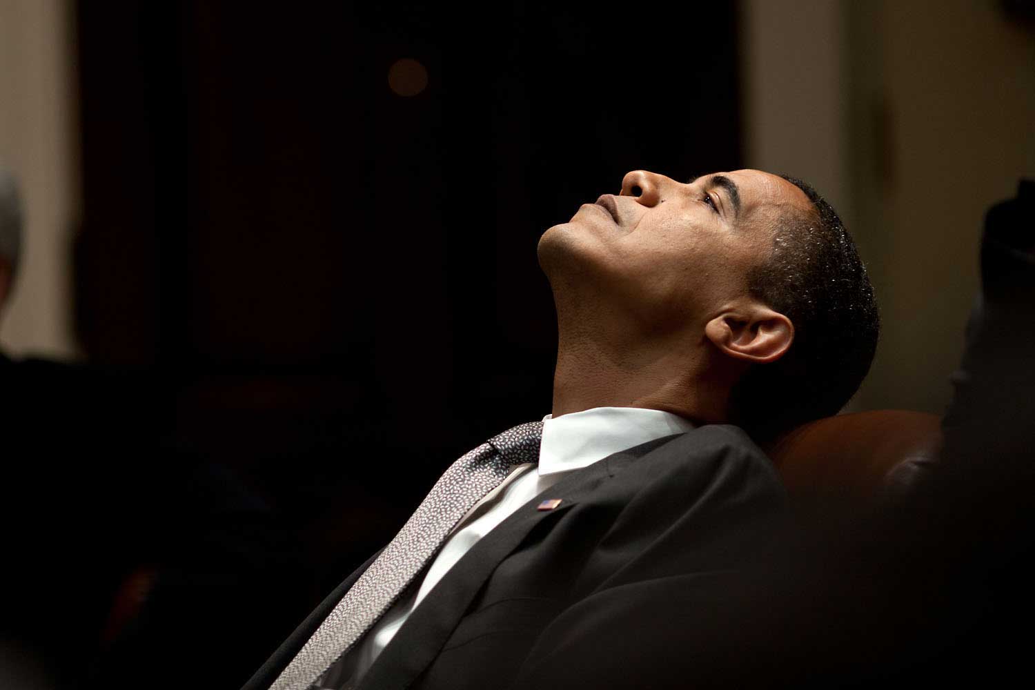 President Obama reflects during an economic meeting in the Roosevelt Room of the White House, Jan. 29, 2009.