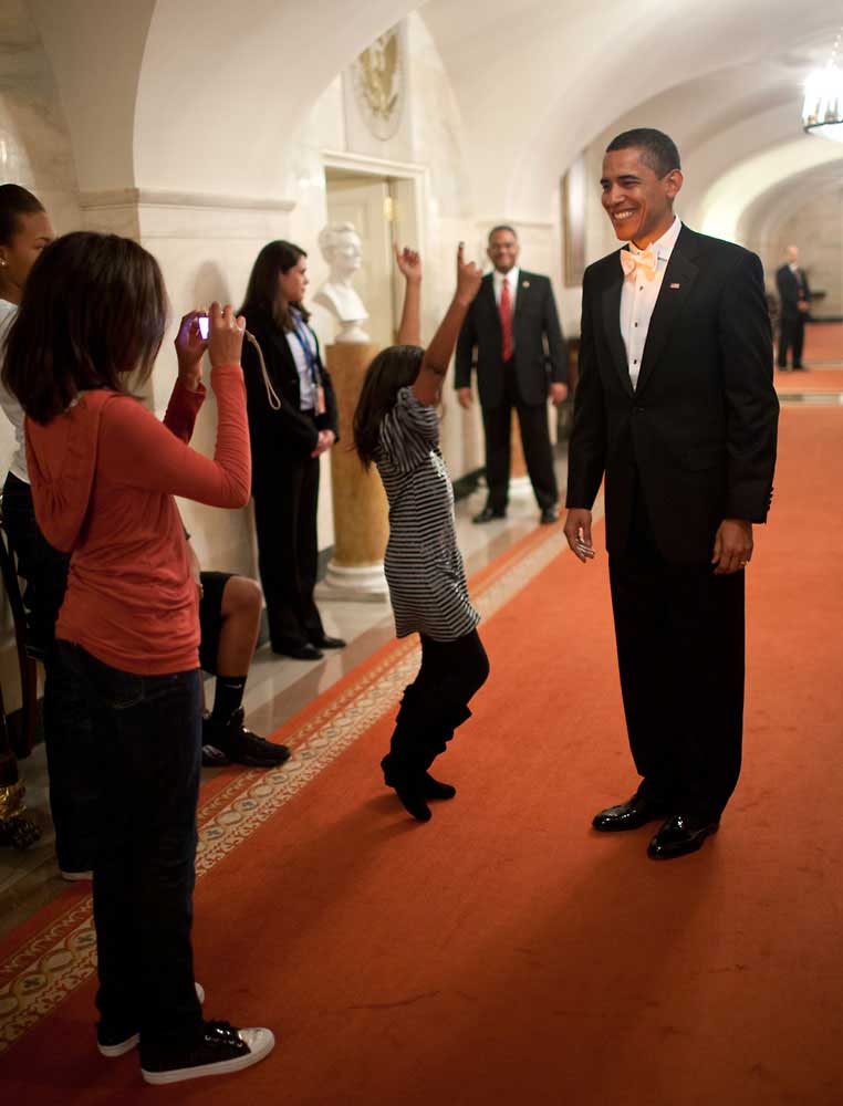 Malia Obama takes a picture of her father, President Obama, at the White House prior to his departure for the Inaugural Balls, Jan. 20, 2009.