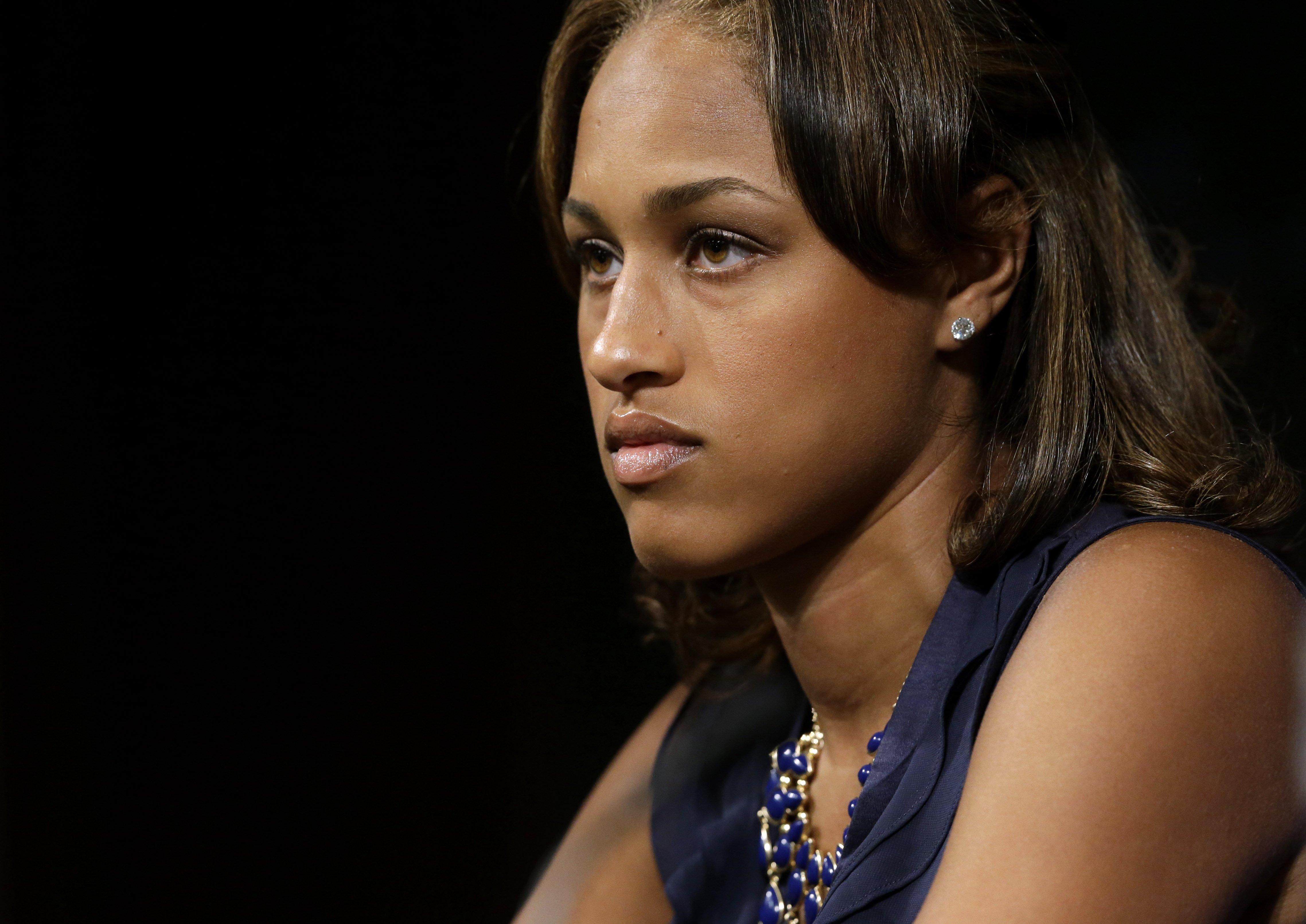 Janay Rice listens as her husband, Baltimore Ravens running back Ray Rice, speaks during a news conference at the team's practice facility in Owings Mills, Md on May 23, 2014. (Patrick Semansky—AP)