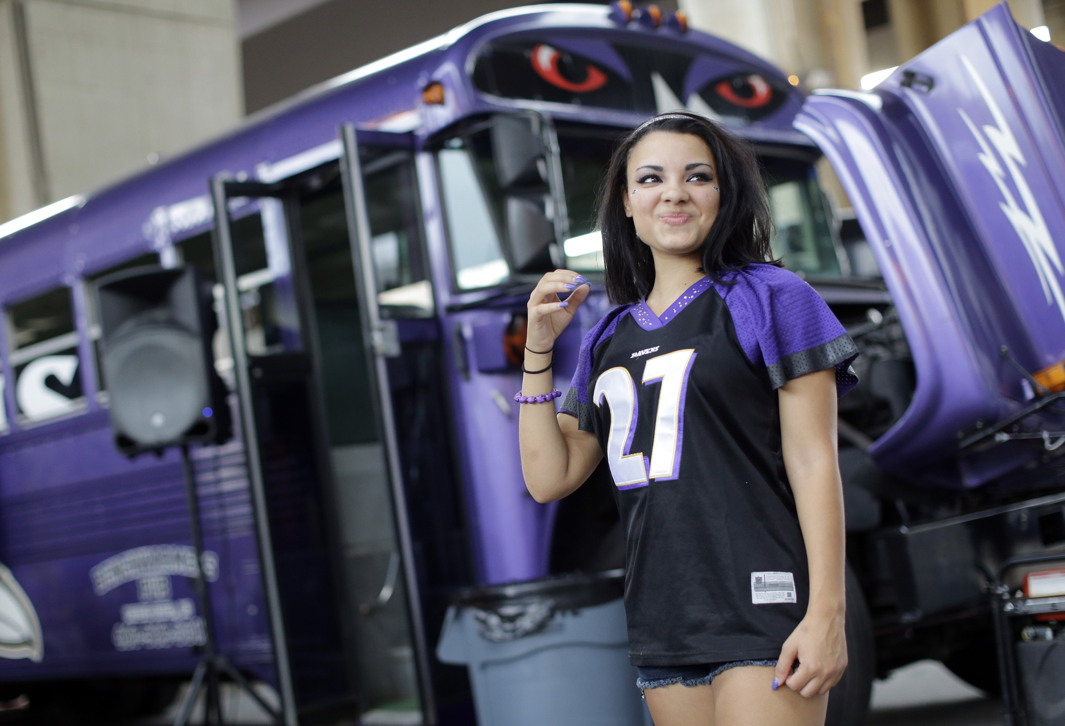 Racquel Bailey wears a Ray Rice jersey as she tailgates before the Baltimore Ravens' NFL football game against the Pittsburgh Steelers on Thursday, Sept. 11, 2014, in Baltimore.