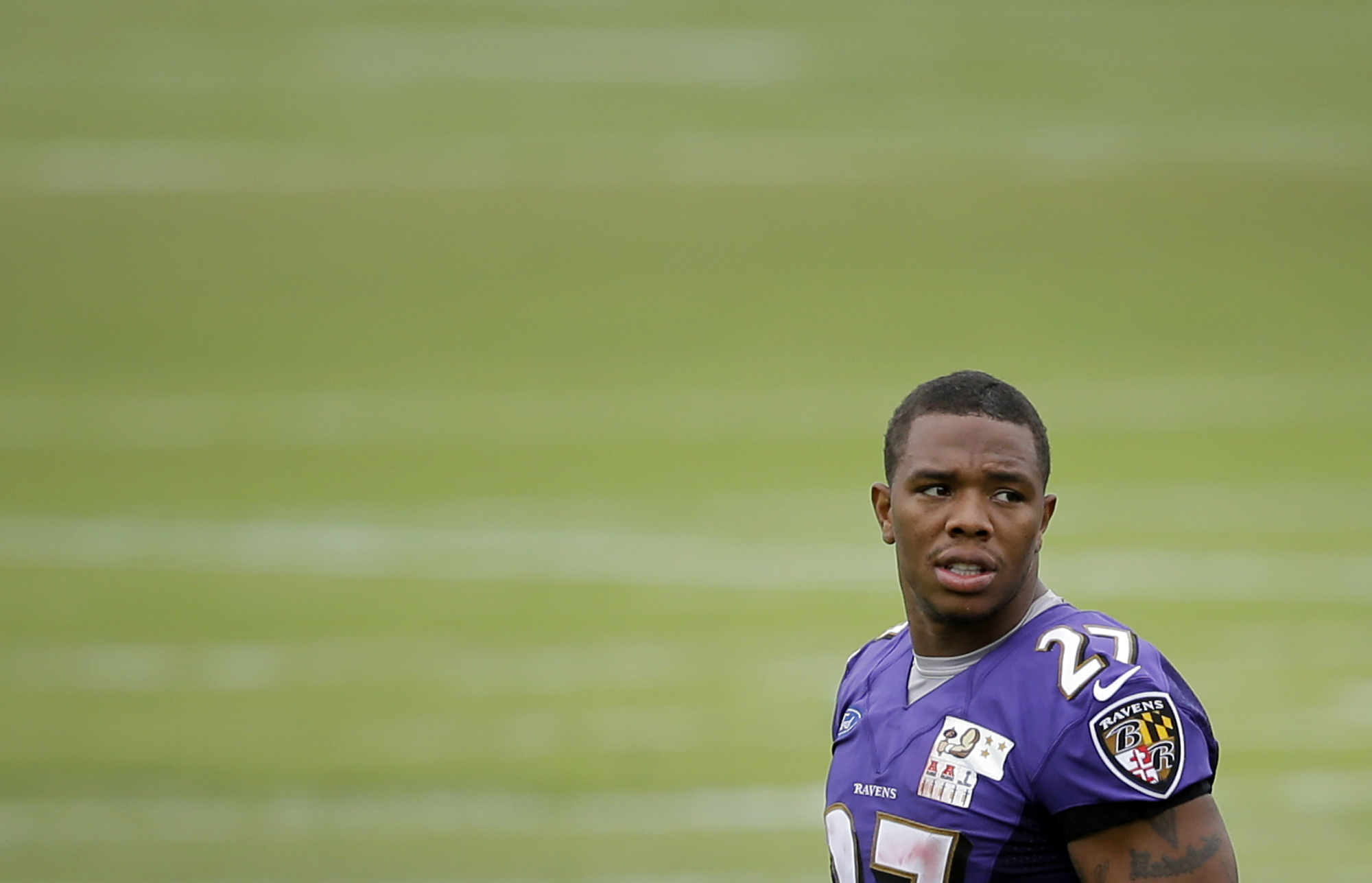 Baltimore Ravens running back Ray Rice walks on the field after a training camp practice on July 24, 2014, at the team's practice facility in Owings Mills, Md. (AP)