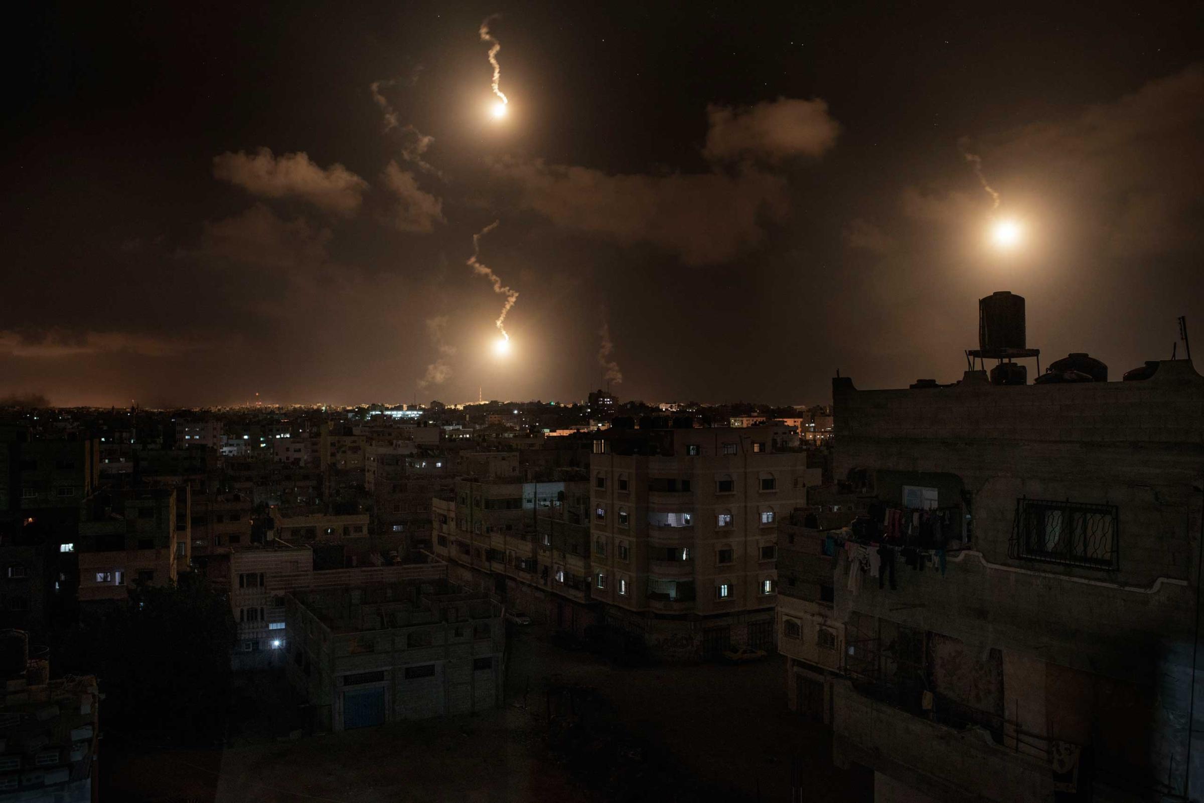 Israeli army flares illuminate the sky above the Gaza Strip, July 18, 2014.