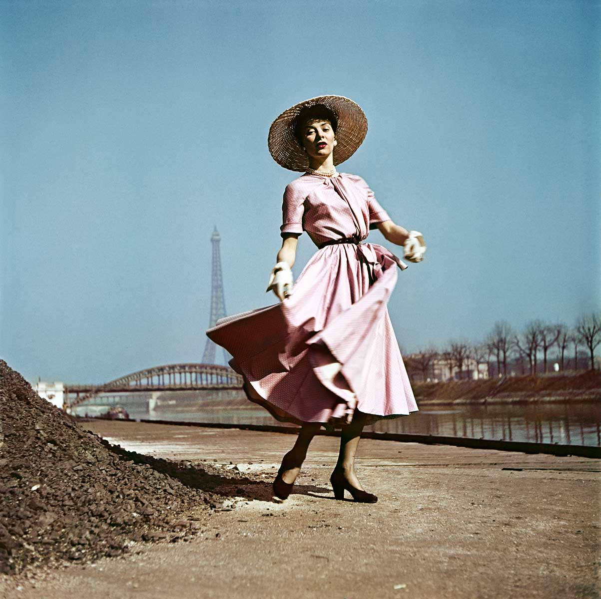 Model wearing Dior on the banks of the Seine, Paris, 1948.
