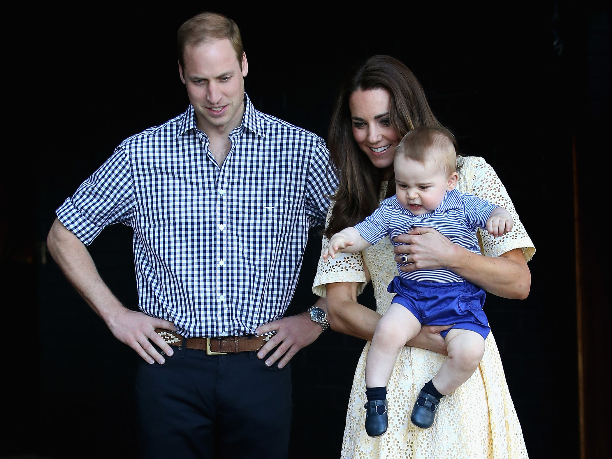 Catherine, Duchess of Cambridge holds Prince George of Cambridge as Prince William, Duke of Cambridge looks on at Taronga Zoo on April 20, 2014 in Sydney.