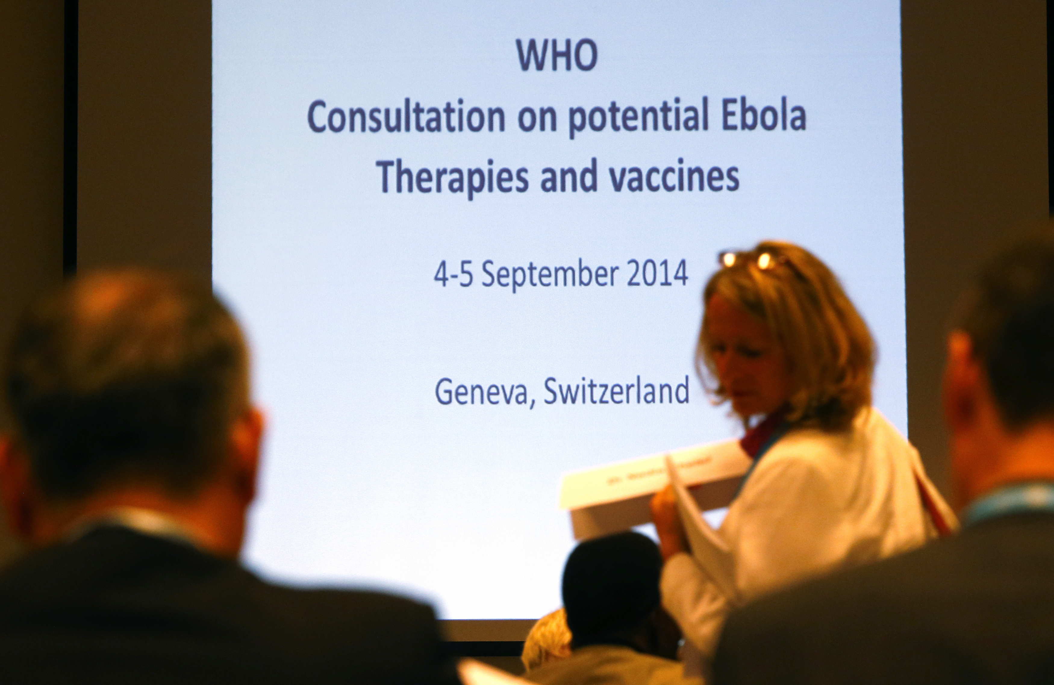 Participants arrive at the opening of a consultation of international experts on potential Ebola therapies and vaccines in Geneva September 4, 2014. (Denis Balibouse / Reuters—REUTERS)