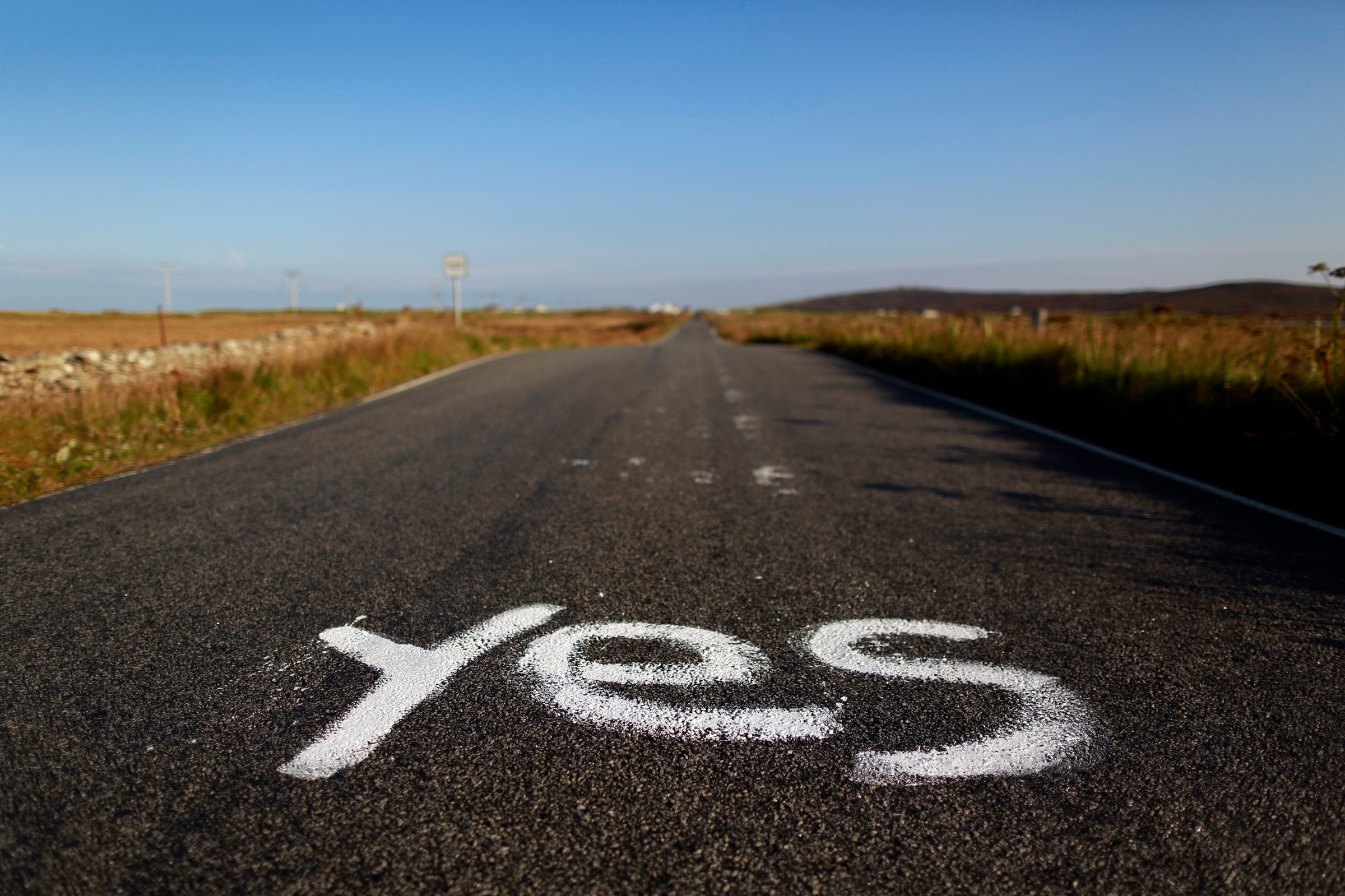 Graffiti supporting the "Yes" campaign is painted on a road in North Uist in the Outer Hebrides