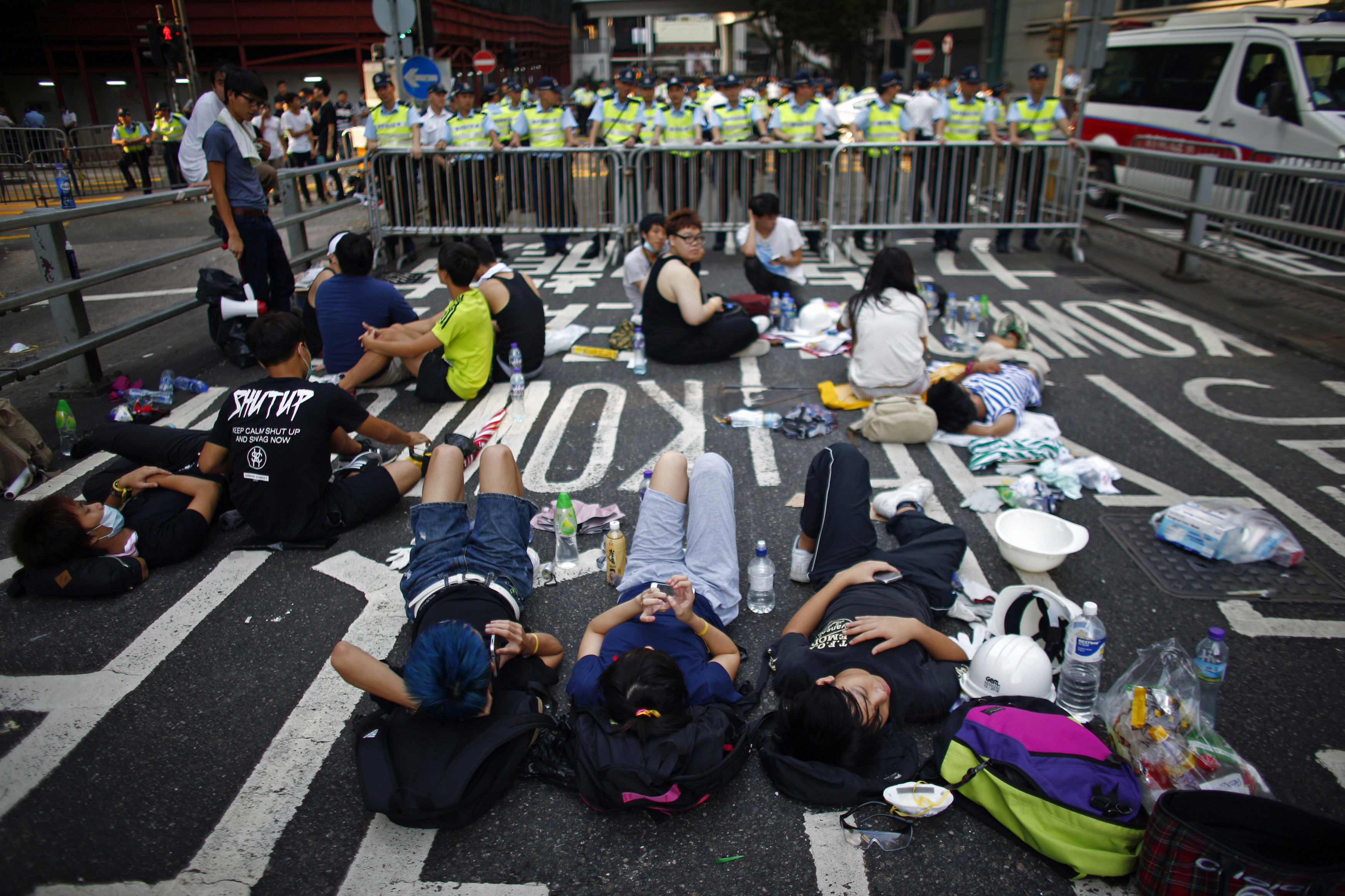 Protesters block a street near government headquarters in Hong Kong