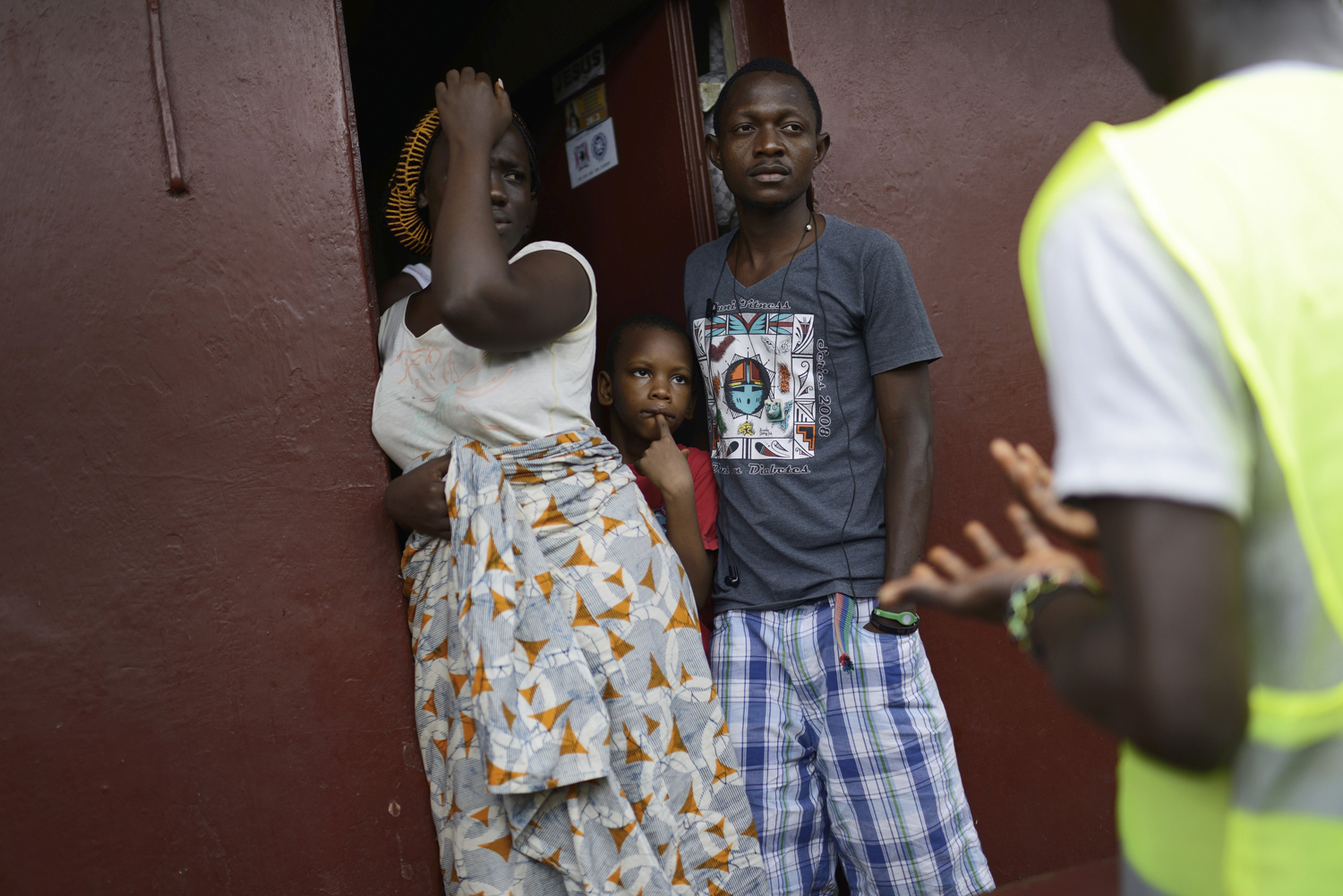 A group of volunteers inform residents about Ebola and a lockdown in the Brookfield neighborhood of Freetown, Sierra Leone, Sept. 19, 2014.