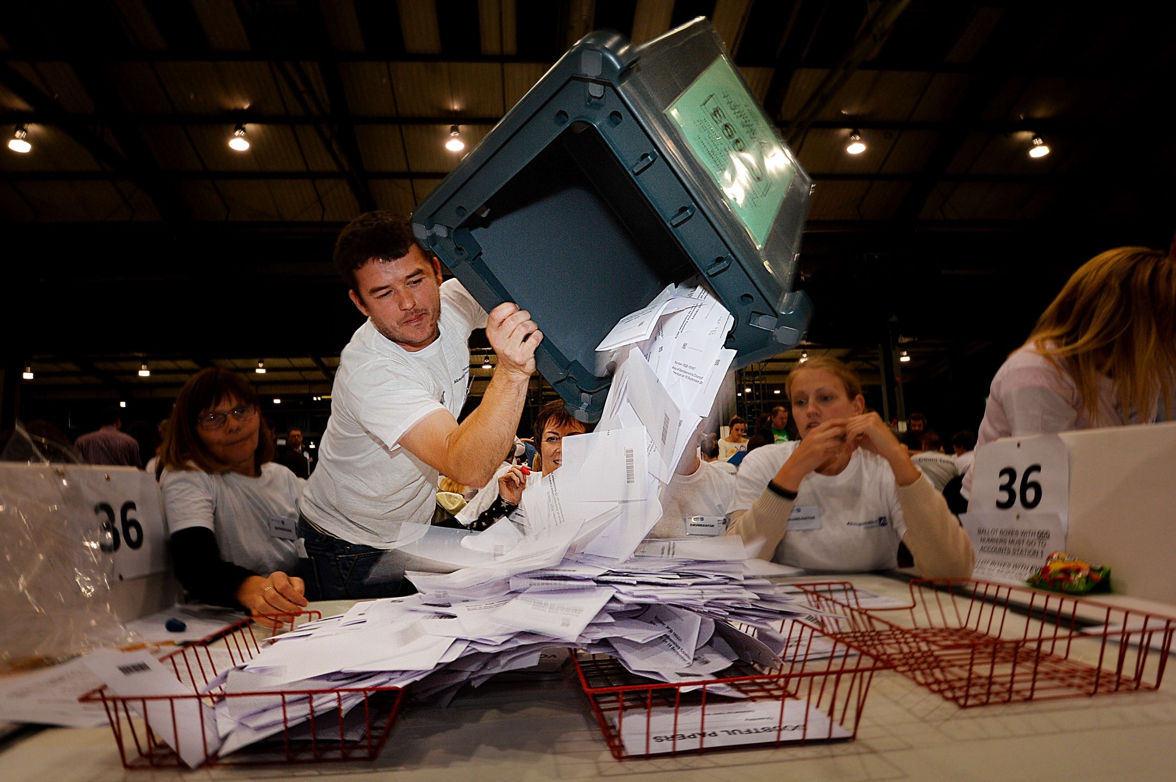 A worker tips out a ballot box in the Aberdeen Exhibition and Conference Centre in Aberdeen, on Sept.r 18, 2014, immediately after the polls close in the referendum on Scotland's independence.