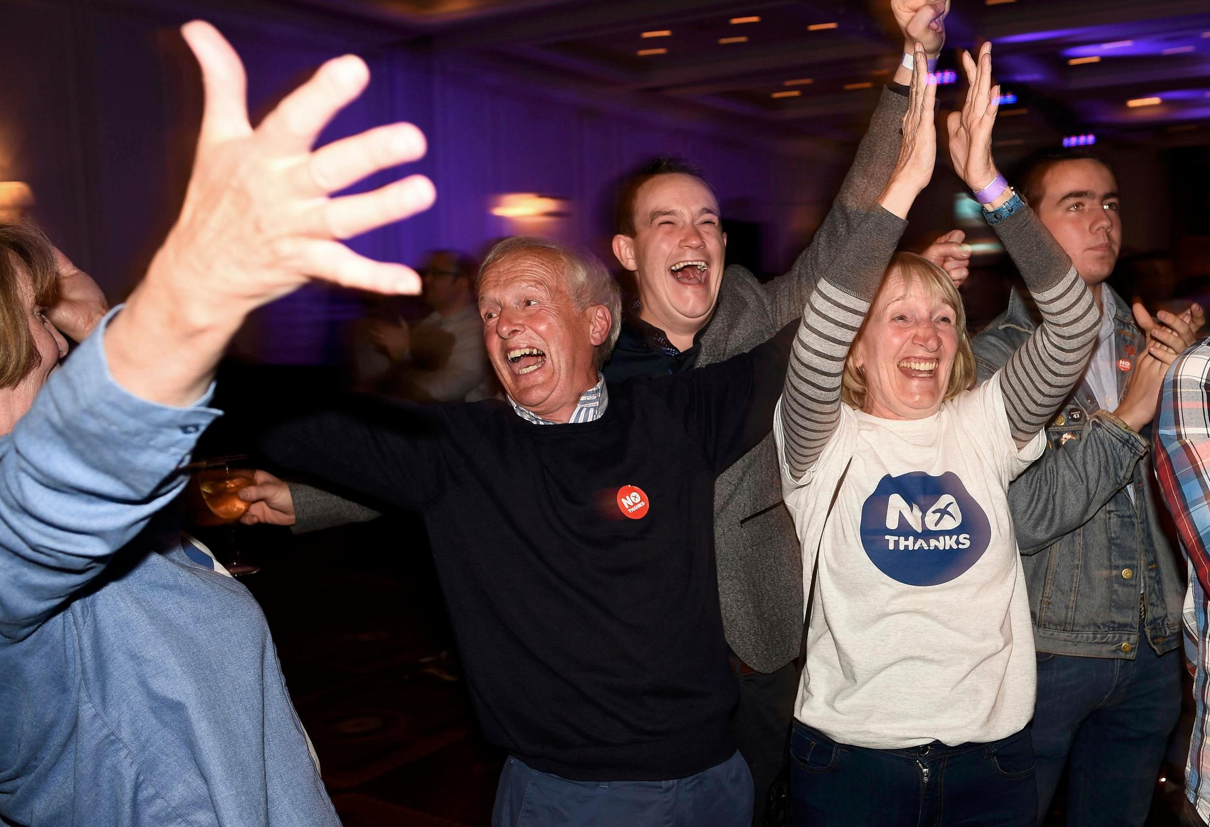 Supporters from the "No" Campaign react to a declaration in their favour, at the Better Together Campaign headquarters in Glasgow, Scotland, Sept. 19, 2014.