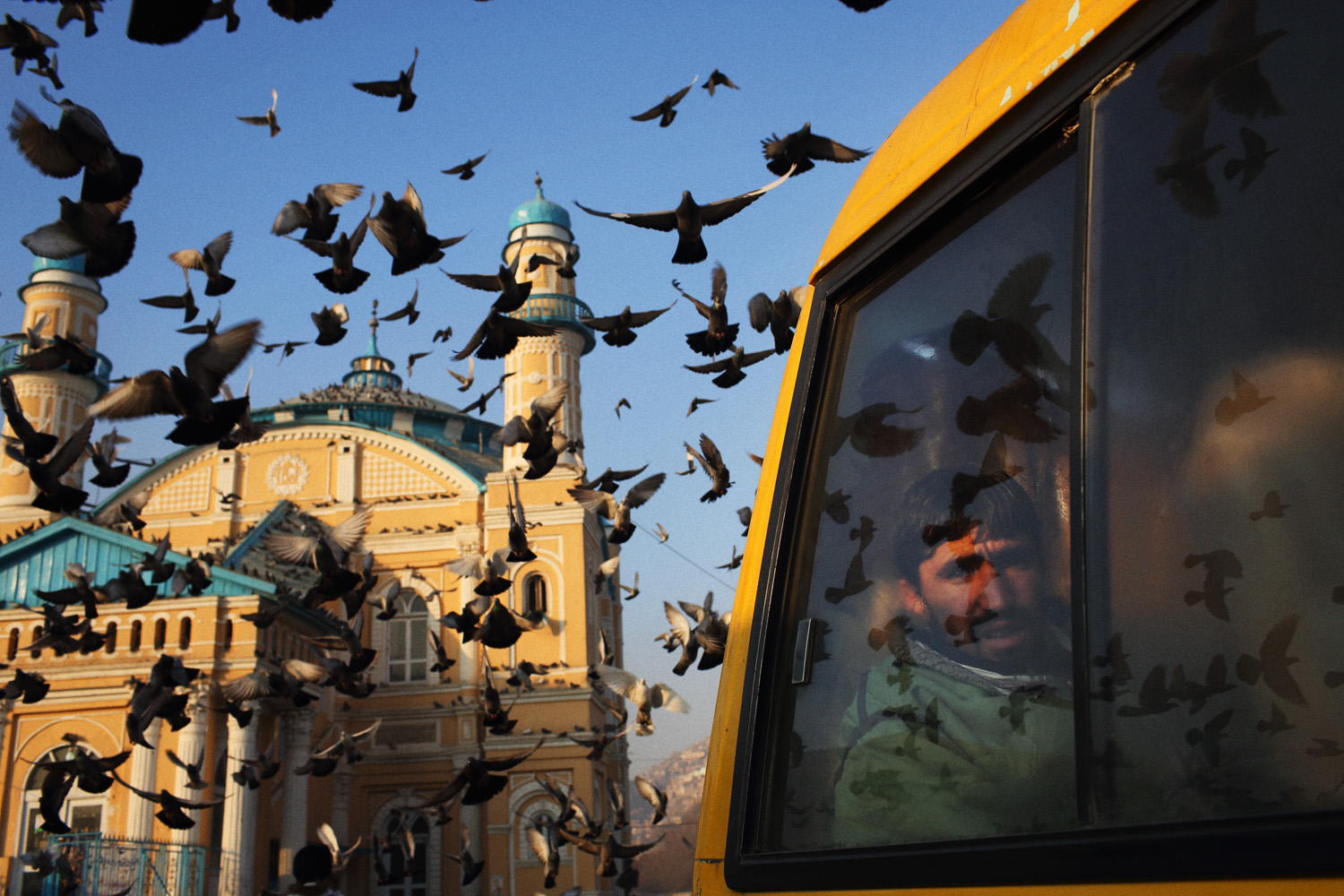 Pigeons take to the sky outside Shah e-Doh Shamshira Mosque in Kabul.