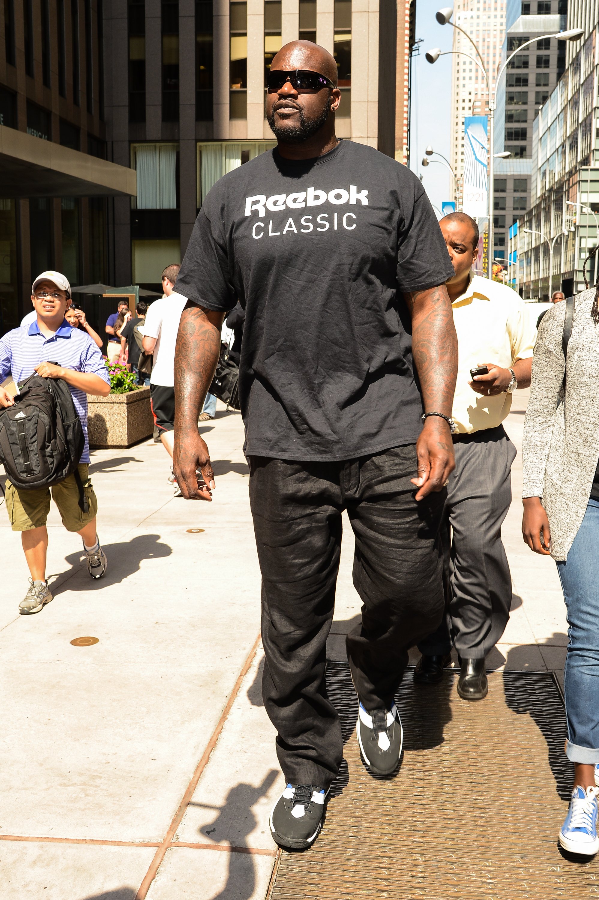 Television personality and former professional basketball player Shaquille O'Neal leaves the Sirius XM Studios in New York City on Aug. 11, 2014. (Ray Tamarra—GC Images/Getty Images)