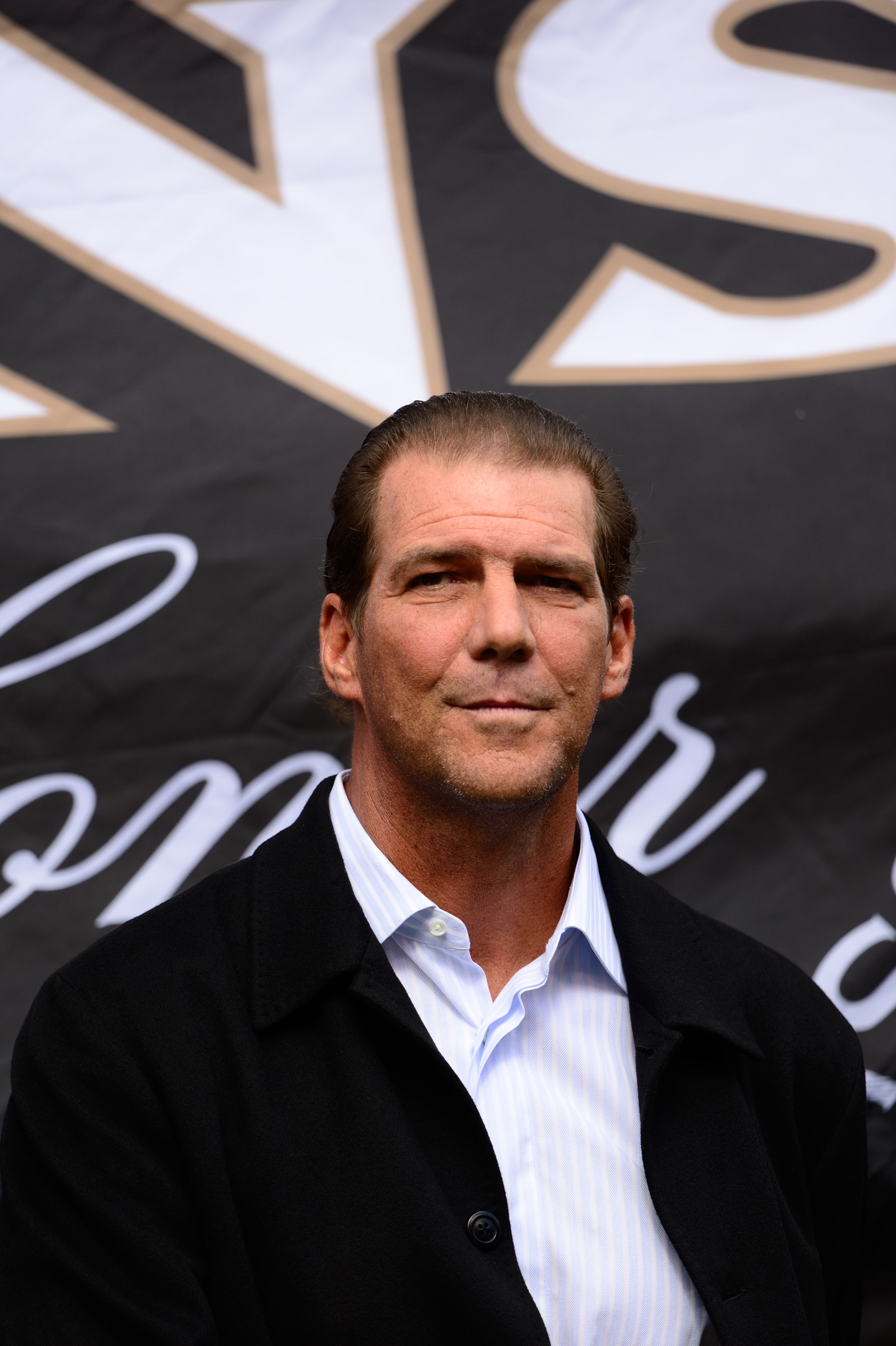 Baltimore Ravens owner Steve Bisciotti on the field during a game between the Houston Texans and the Baltimore Ravens on Sept. 22, 2013, at M&amp;T Bank Stadium in Baltimore (David Drapkin—AP)