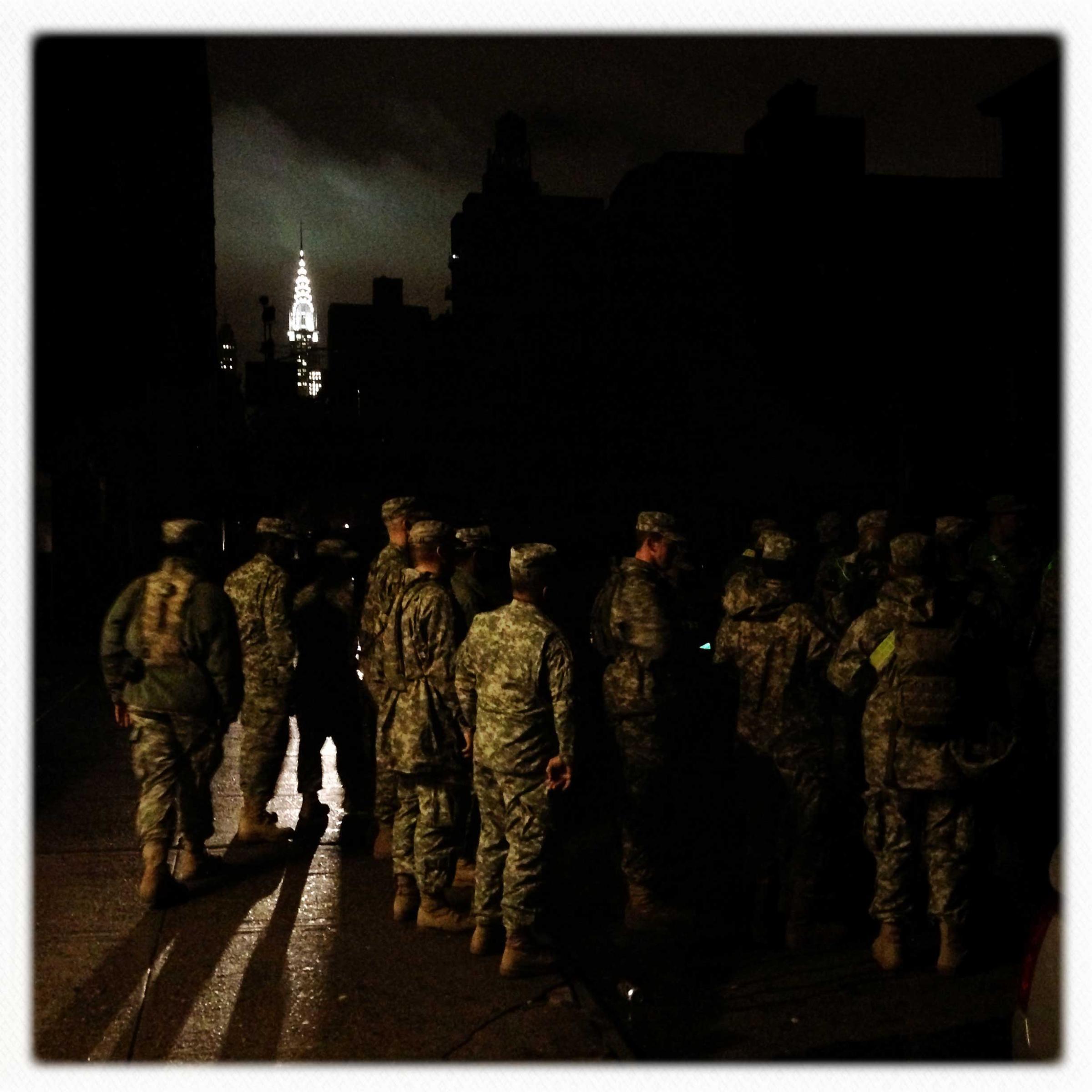 National Guard of the 169th Infantry, Alpha Company, prepare to lend assistance to citizens near 25th street in Manhattan.