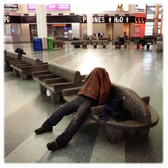 A passenger seeks refuge from the storm in the Staten Island Ferry terminal in Manhattan